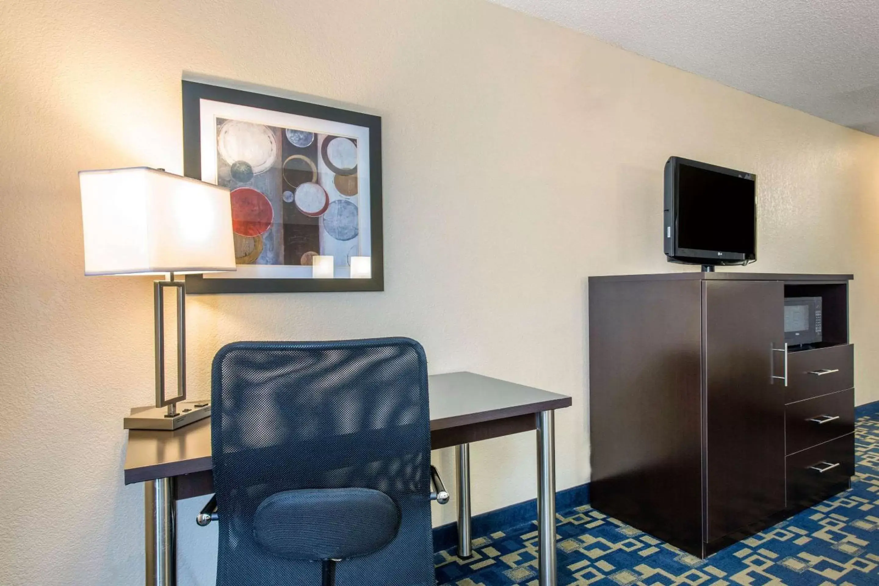 Photo of the whole room, TV/Entertainment Center in Comfort Inn & Suites Near Universal Orlando Resort-Convention Ctr