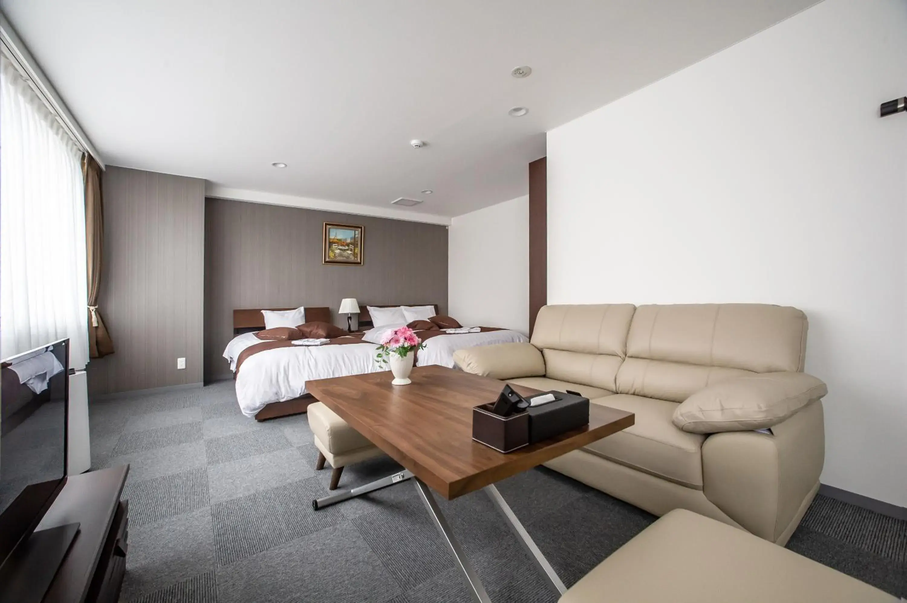 Bed, Seating Area in Condominium Stella Site