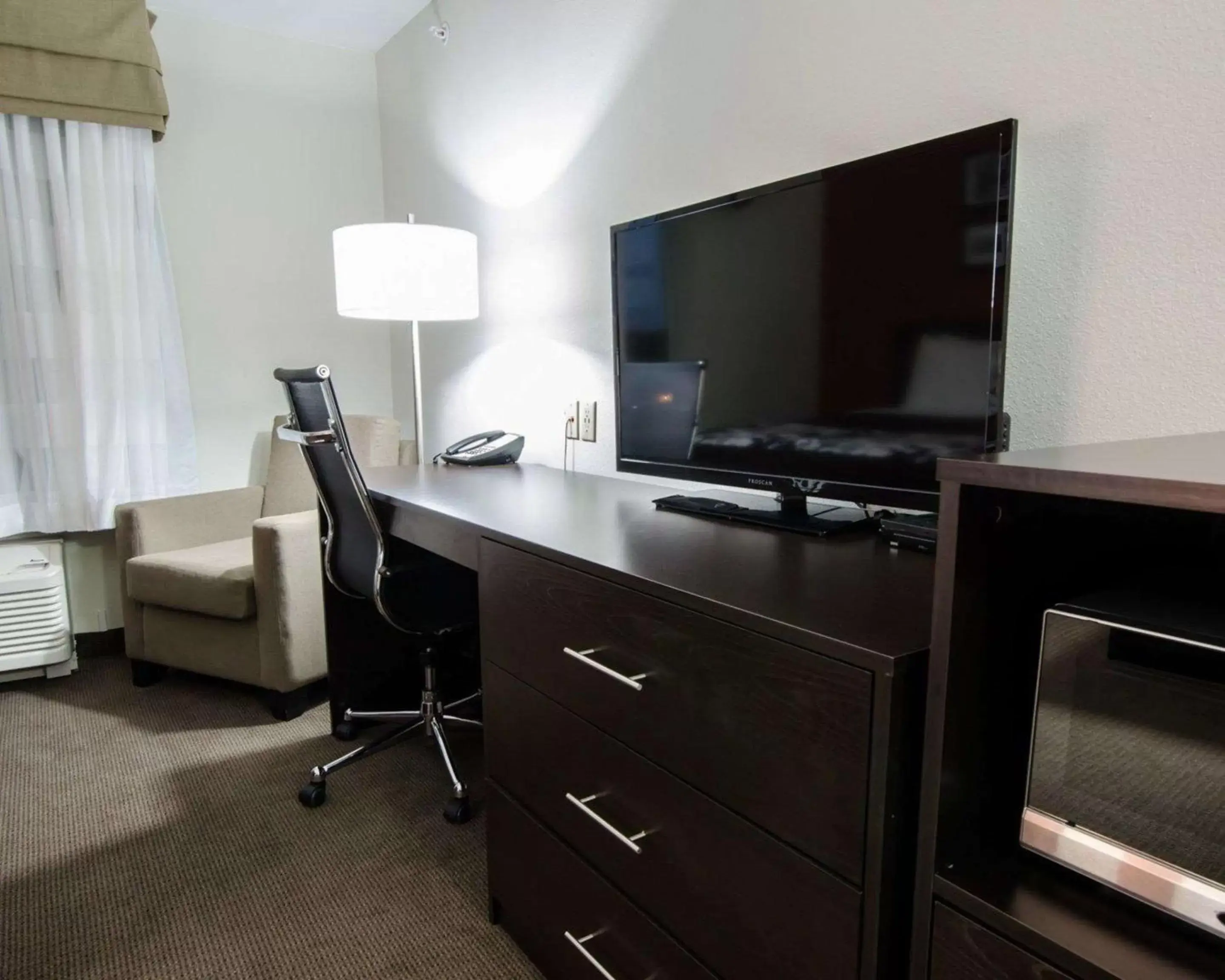 Photo of the whole room, TV/Entertainment Center in Sleep Inn & Suites And Conference Center Downtown