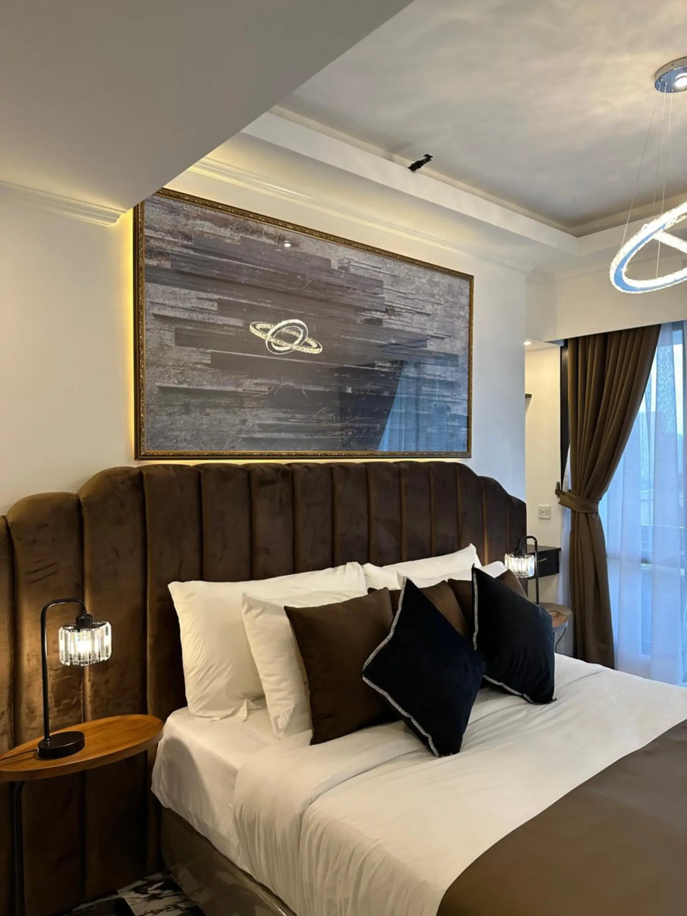 Bed, Seating Area in Mpt Suites