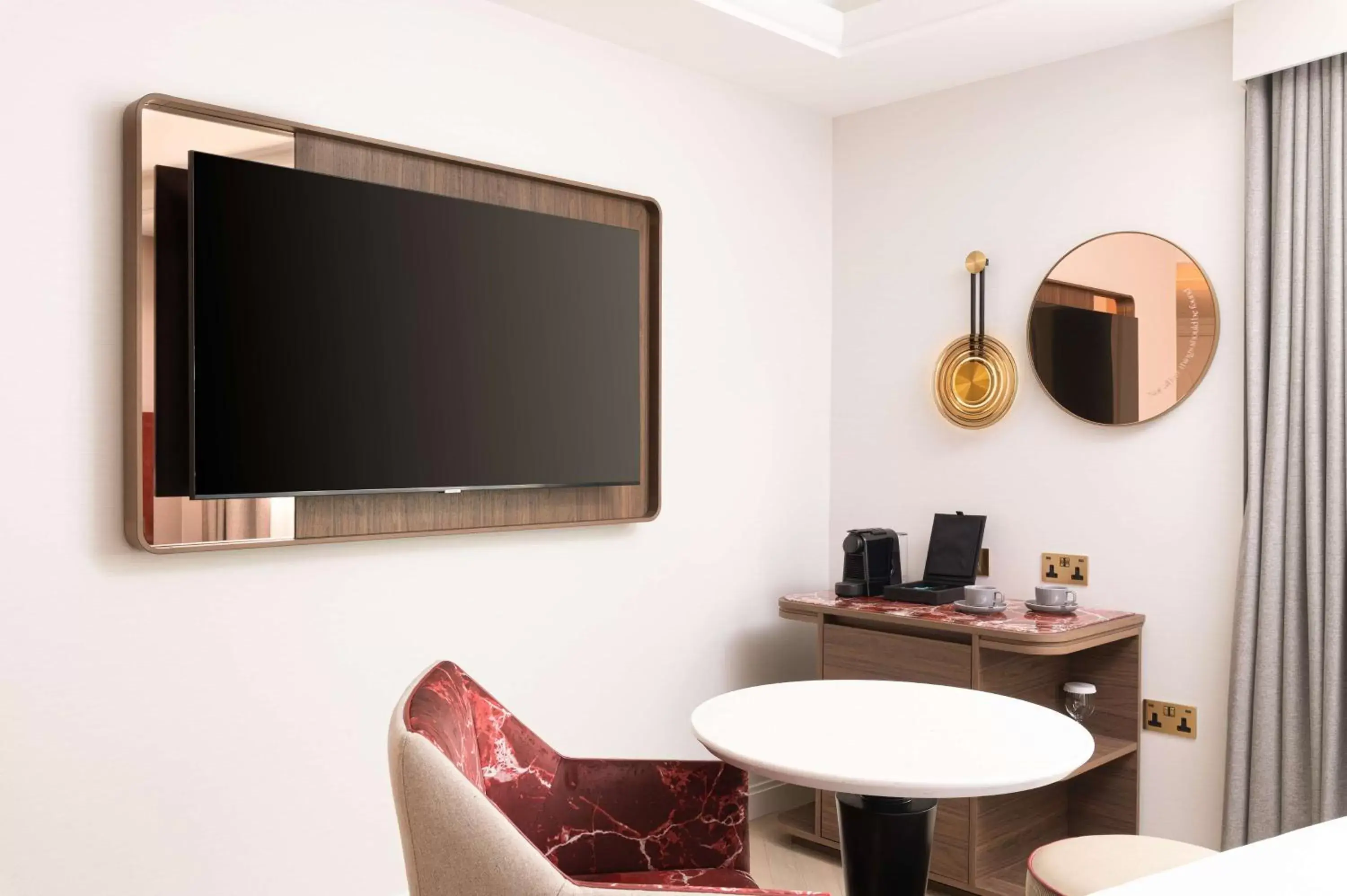 Photo of the whole room, TV/Entertainment Center in Lost Property St Pauls London, Curio Collection By Hilton