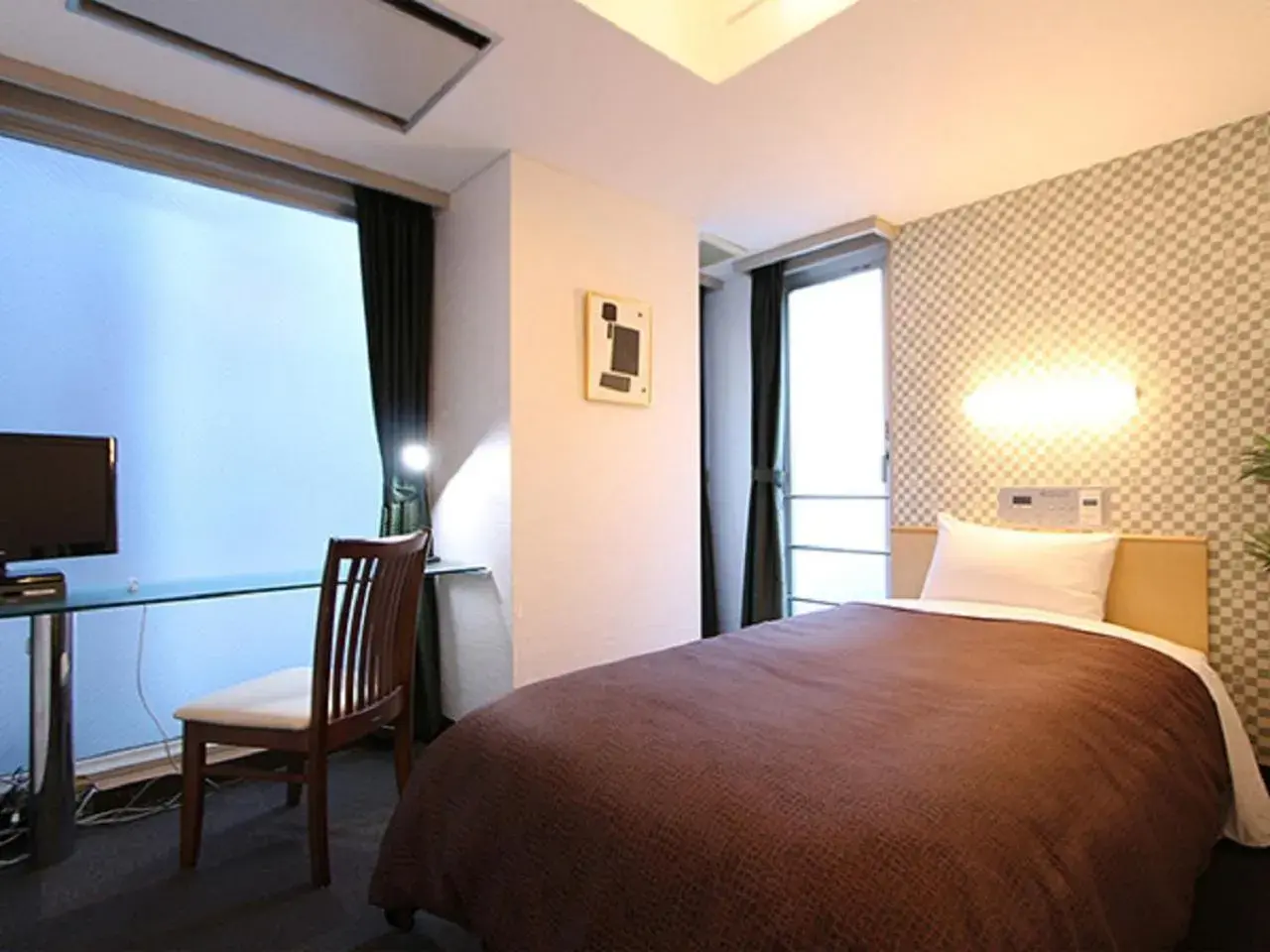 Bed in HOTEL LiVEMAX BUDGET Korakuen