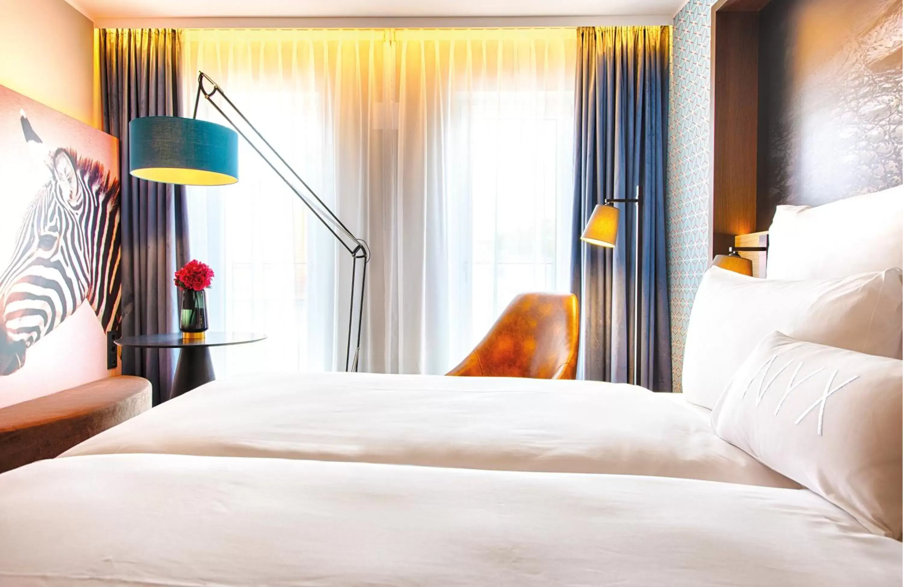 Photo of the whole room, Bed in NYX Hotel Munich by Leonardo Hotels