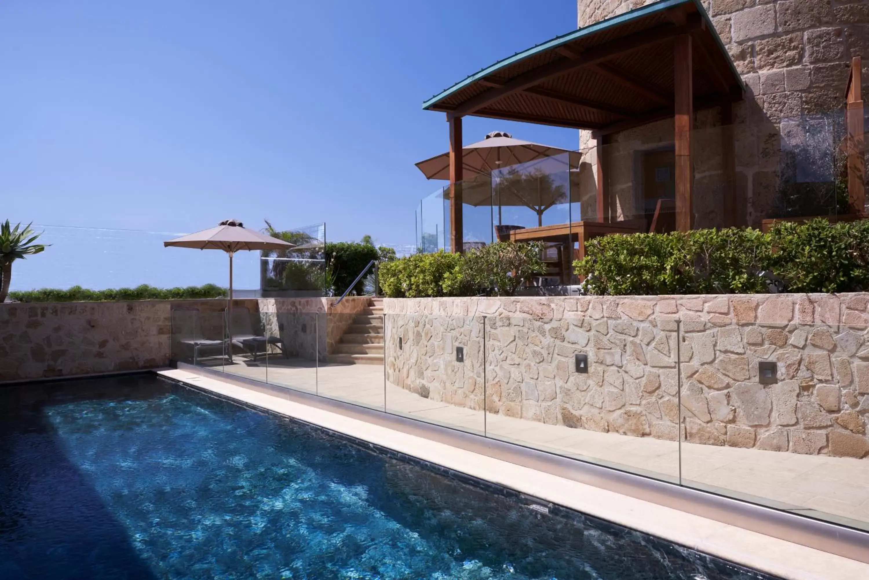 Patio, Swimming Pool in Bellevue On The Beach Suites