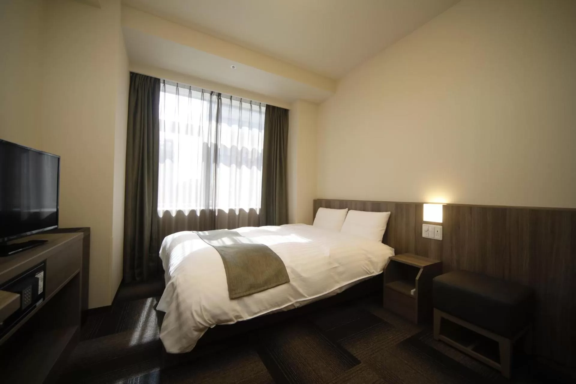 Bed in Dormy Inn Korakuen