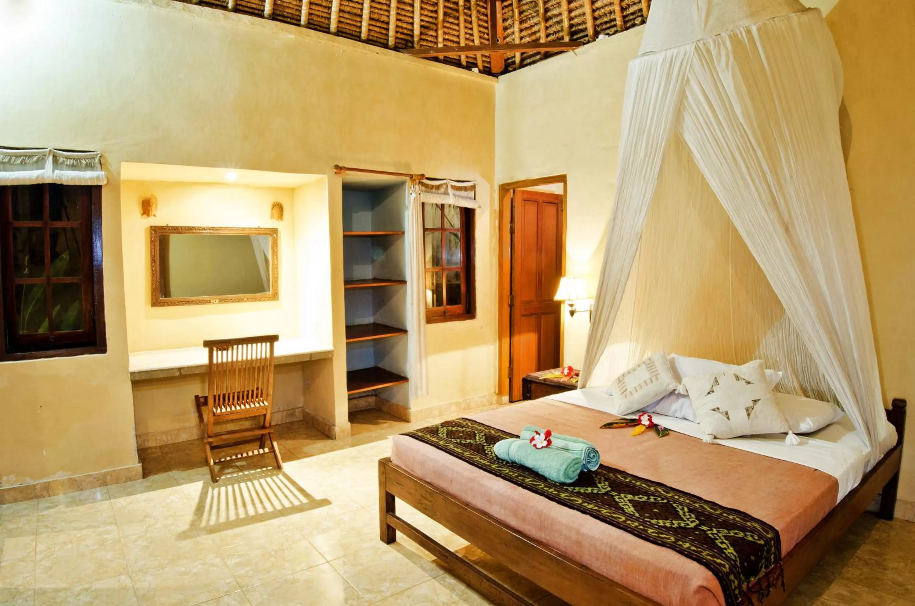 Bed in Mushroom Beach Bungalows