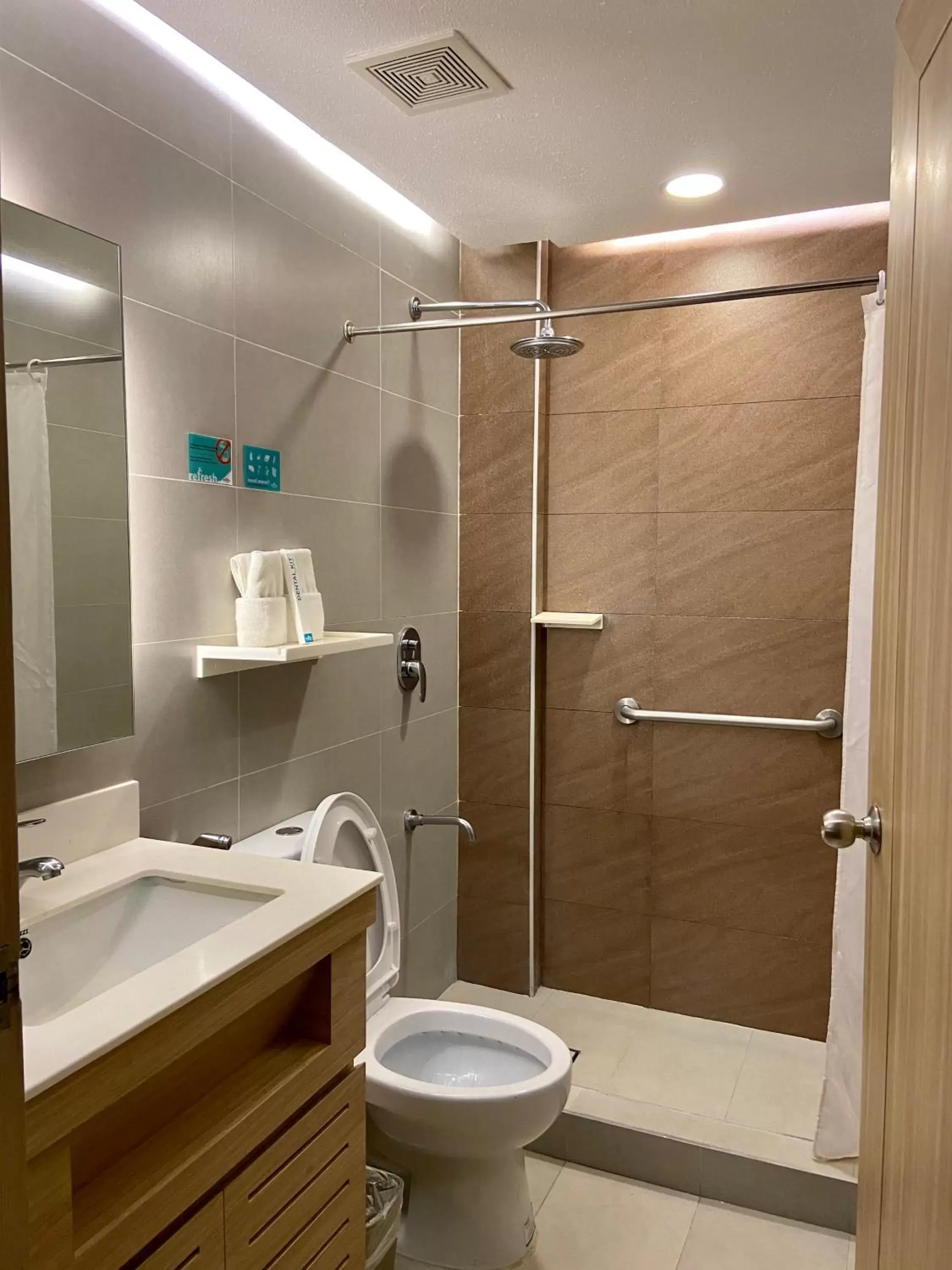 Bathroom in Microtel by Wyndham Tarlac