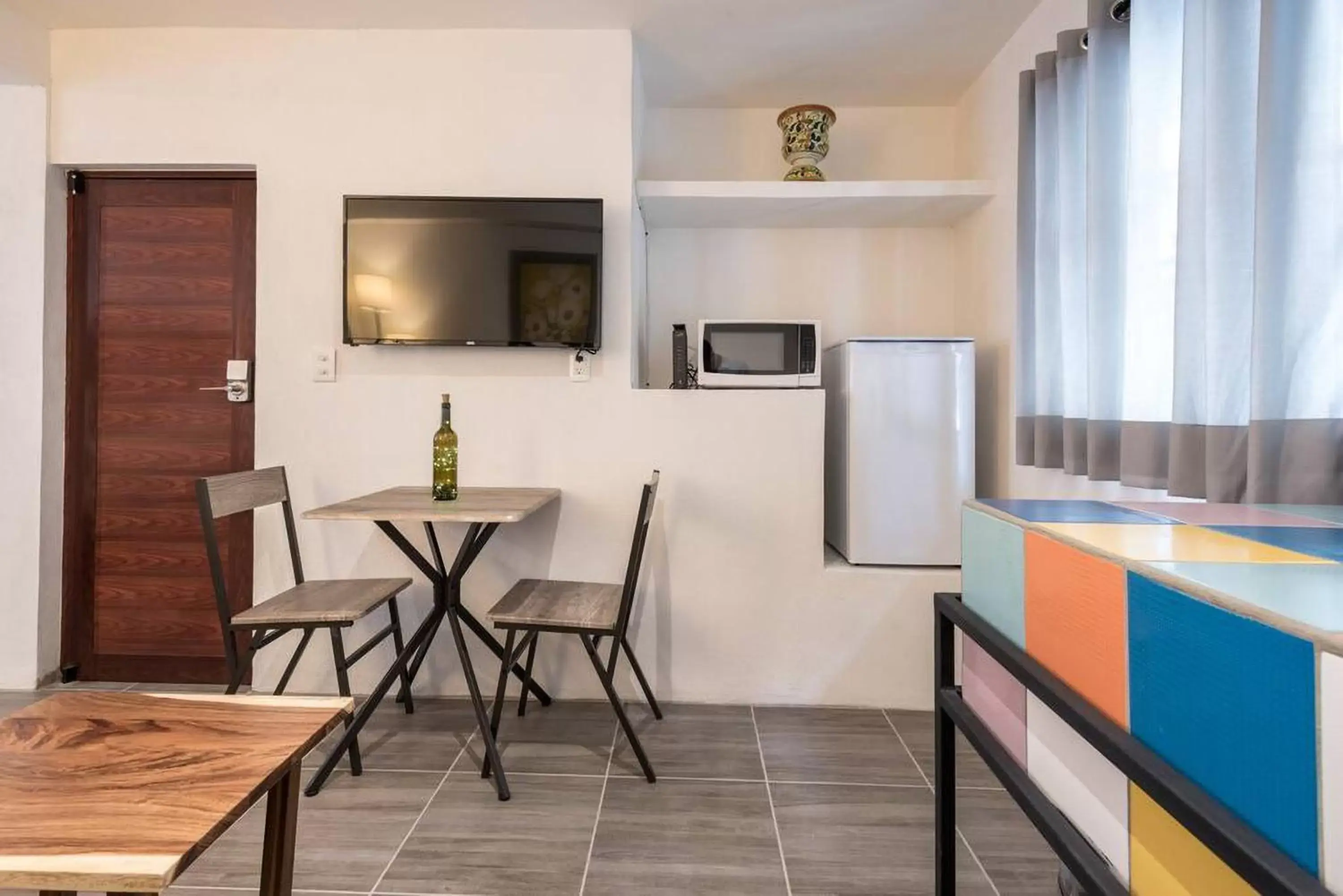 Kitchen or kitchenette, TV/Entertainment Center in ZonaZ Boutique Hotel