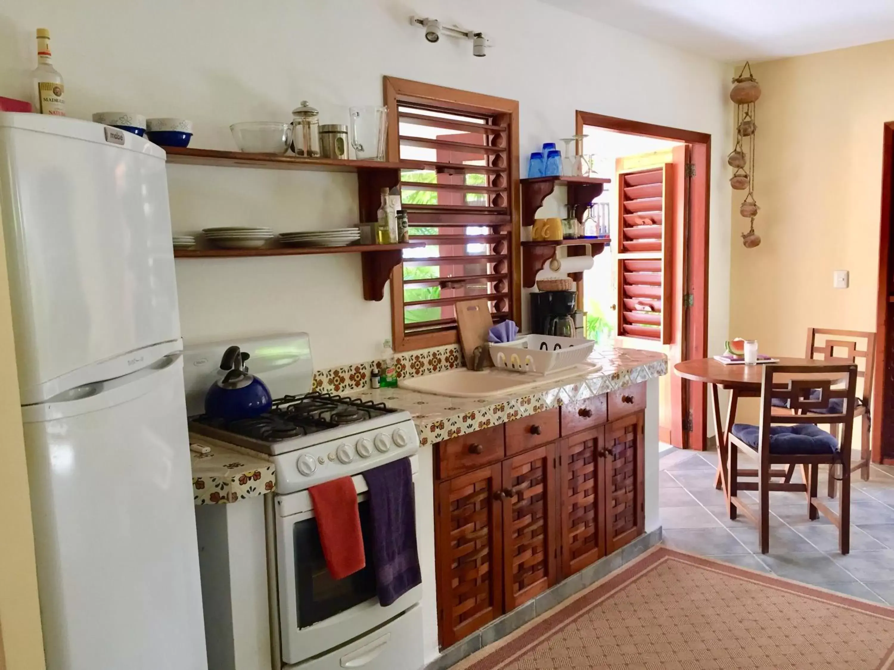 Kitchen/Kitchenette in Nah Uxibal Villa and Casitas