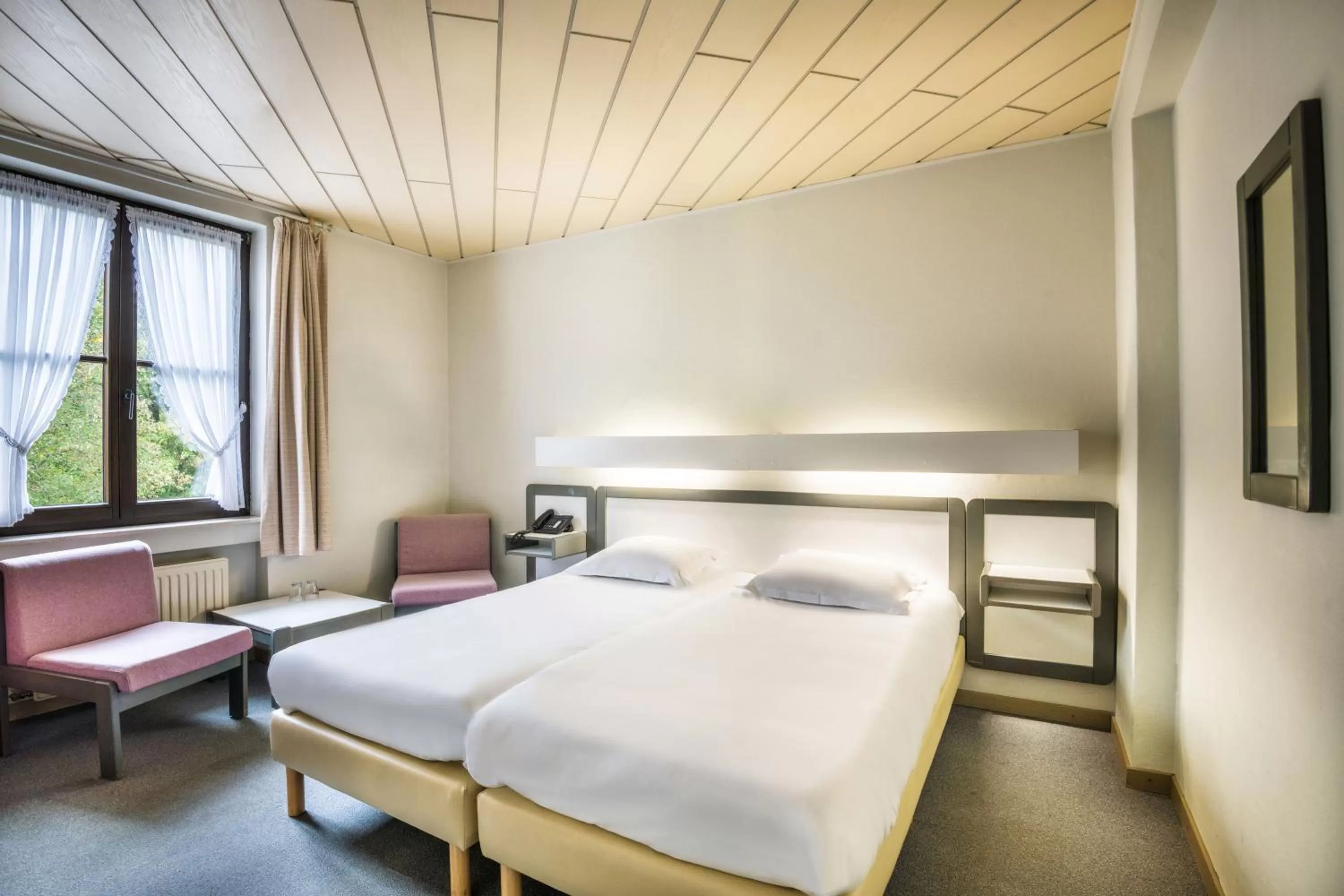 Bed in Hotel Le Postillon