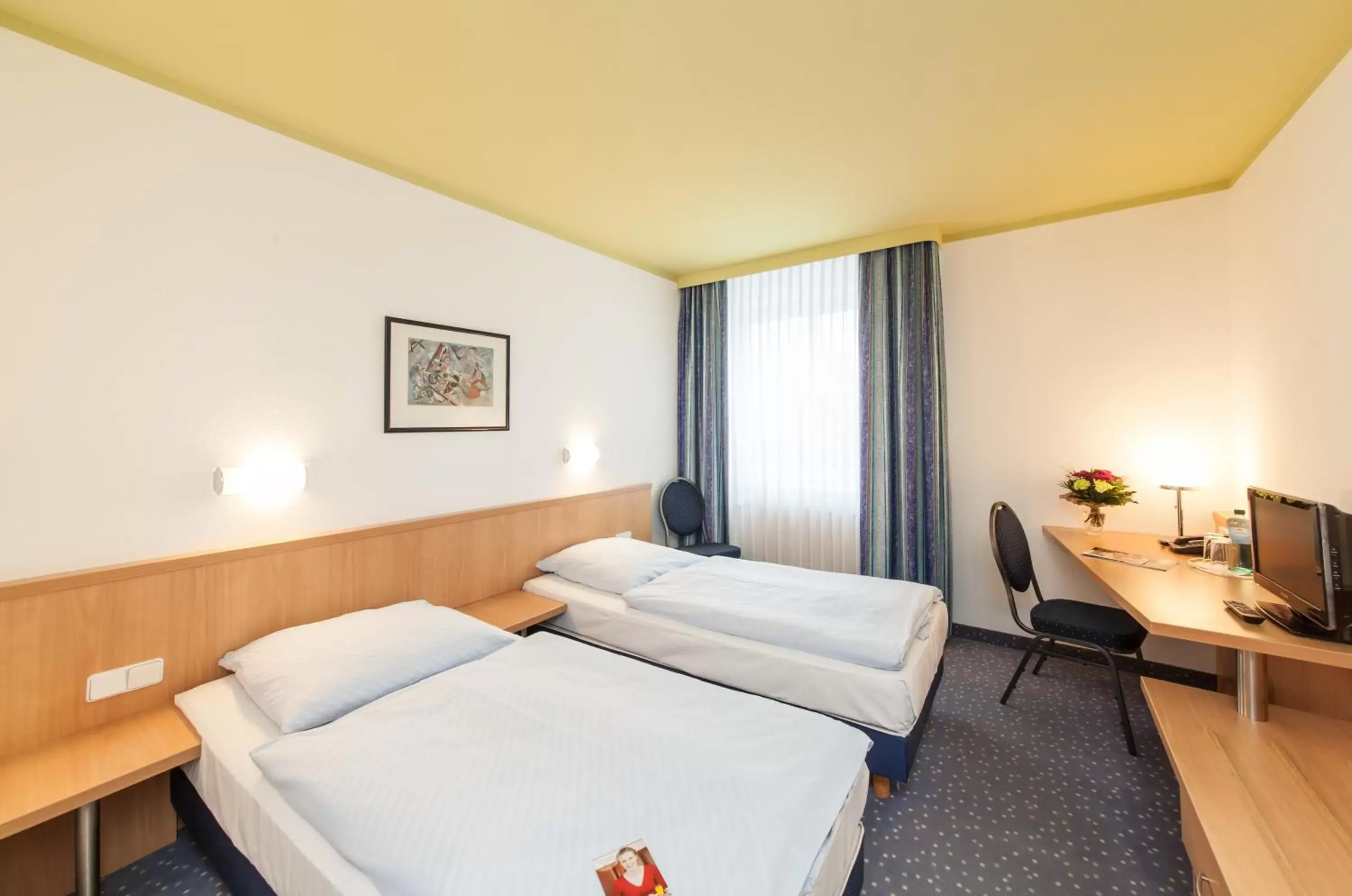 Photo of the whole room, Bed in Novum Hotel Seegraben Cottbus