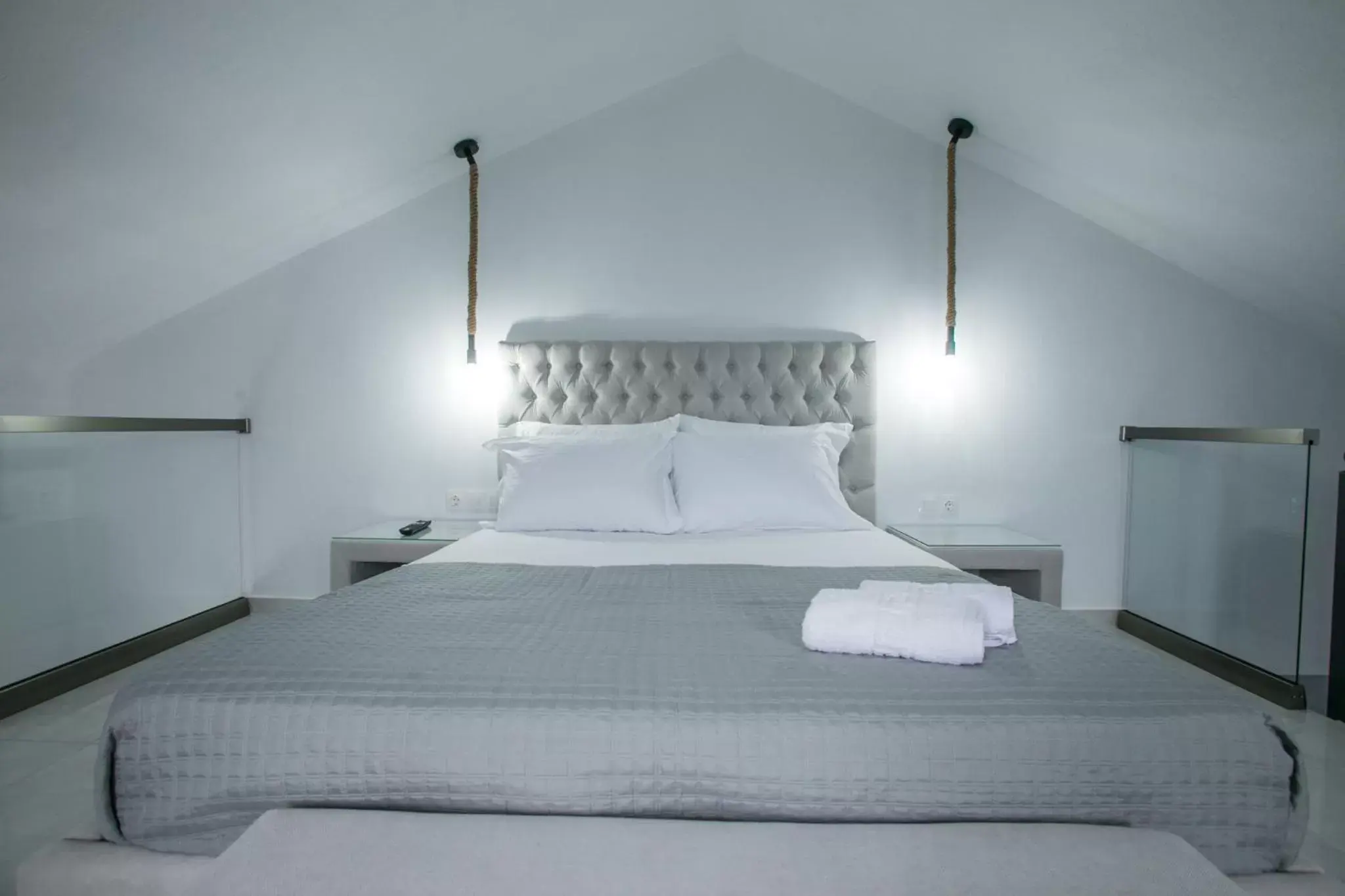 Bed in Anemos Luxury Apartments