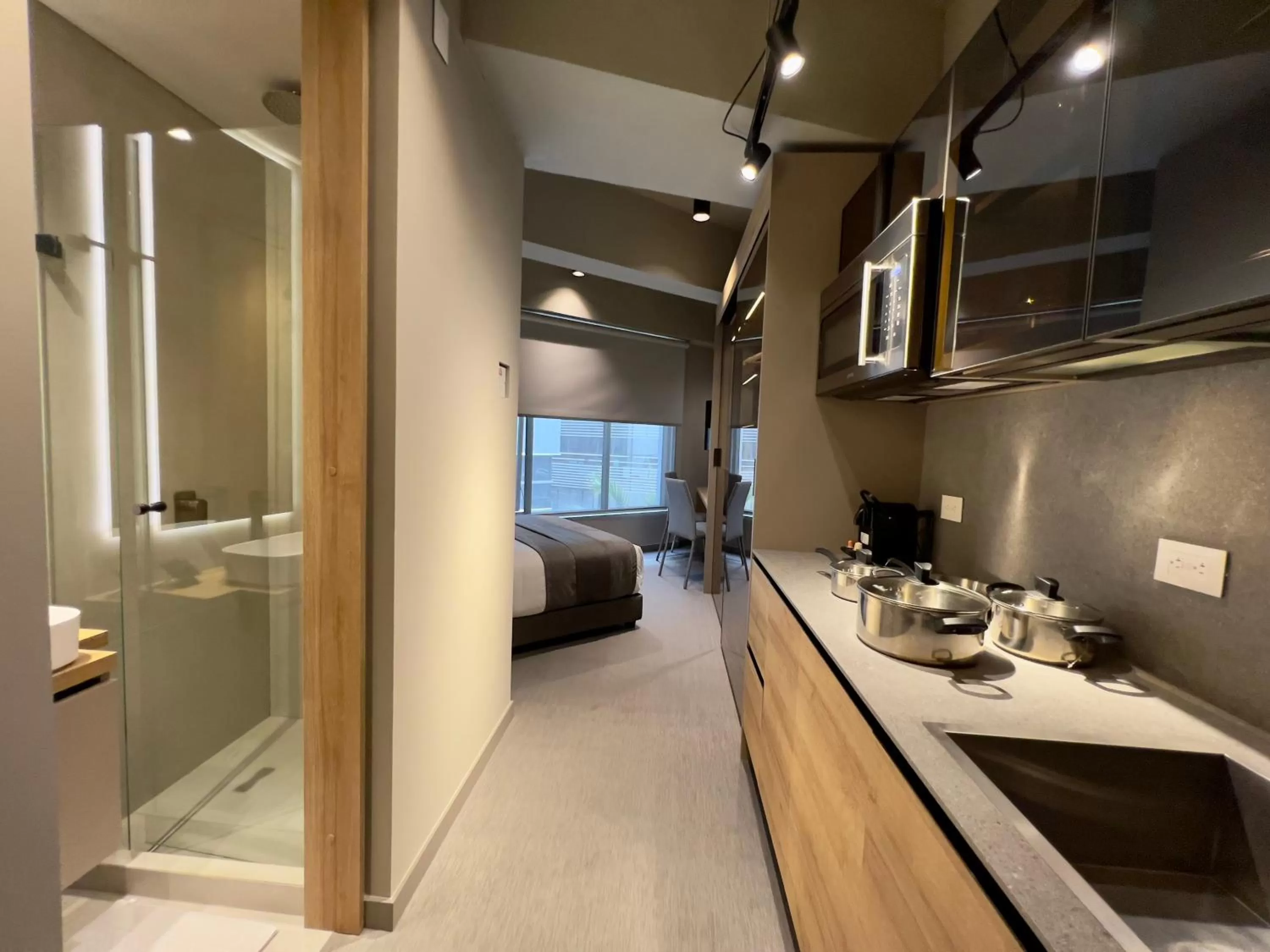 Bedroom, Bathroom in ICON 100 Luxury Apartasuites