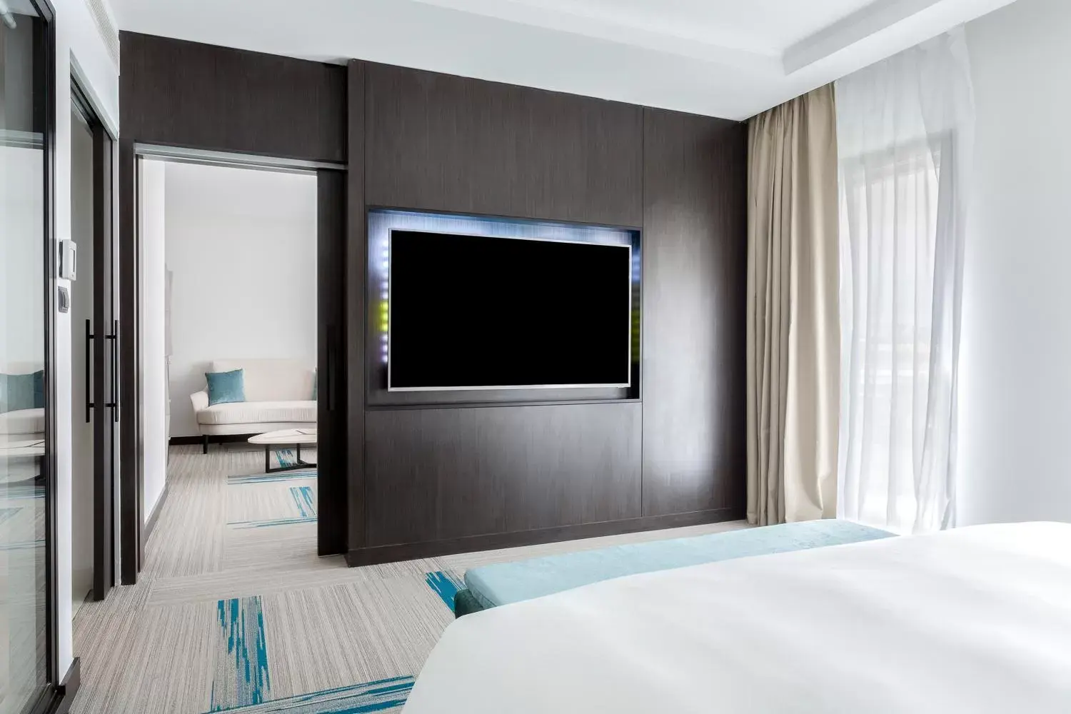 Bed, TV/Entertainment Center in Novotel Convention And Spa