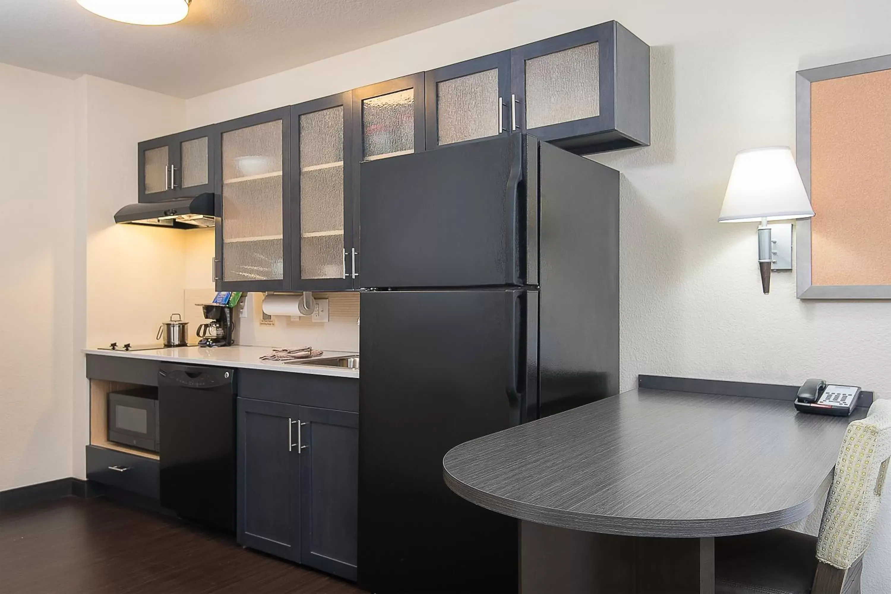 Photo of the whole room, Kitchen/Kitchenette in Candlewood Suites Bloomington, an IHG Hotel