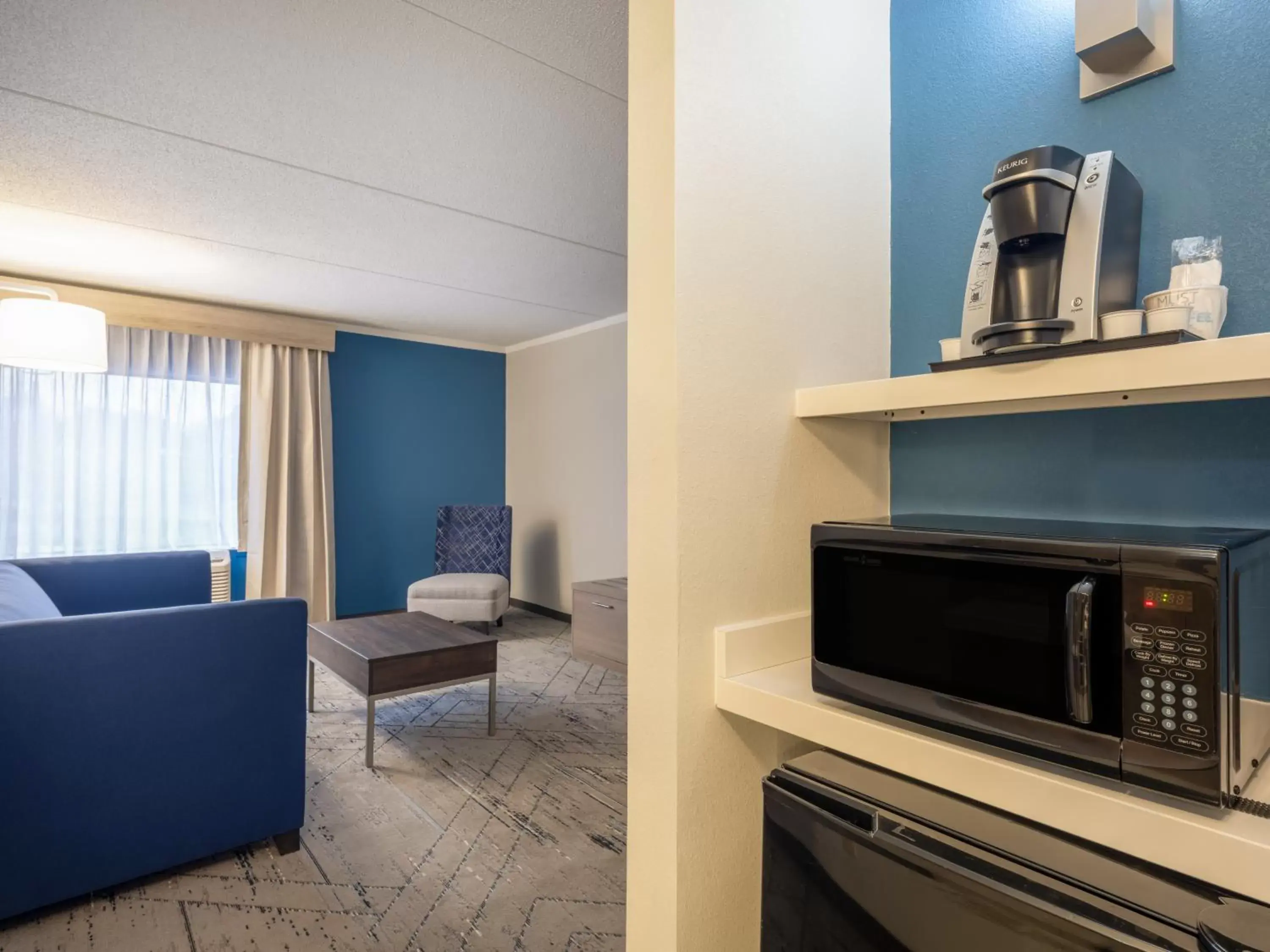 Coffee/tea facilities, TV/Entertainment Center in Holiday Inn Express & Suites Greensboro - I-40 atWendover, an IHG Hotel