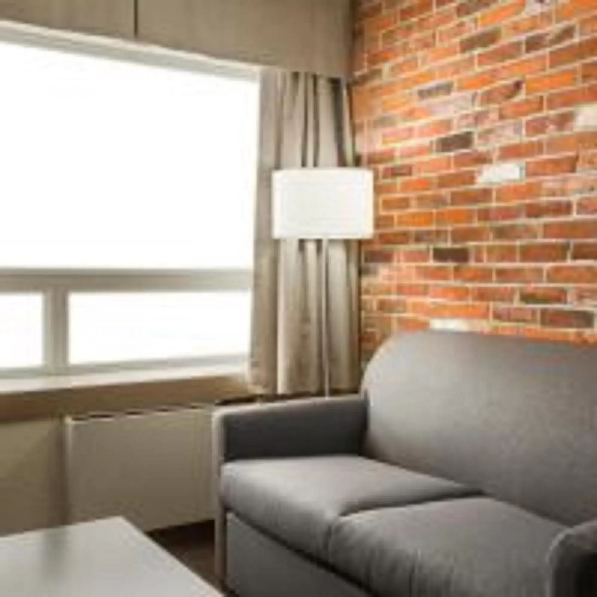 Bedroom, Seating Area in Super 8 by Wyndham Timmins ON