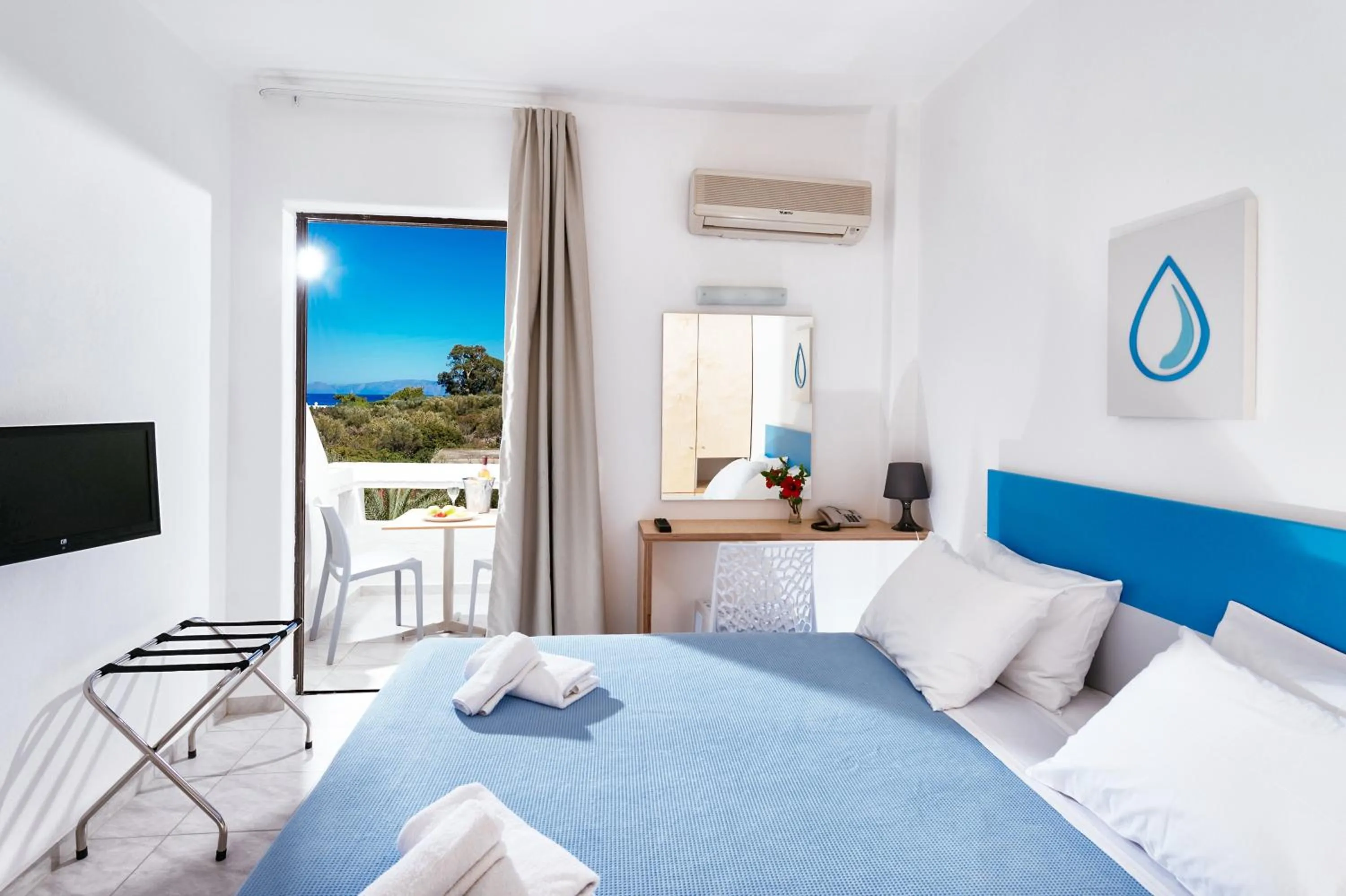 Photo of the whole room, Bed in Elounda Krini Hotel