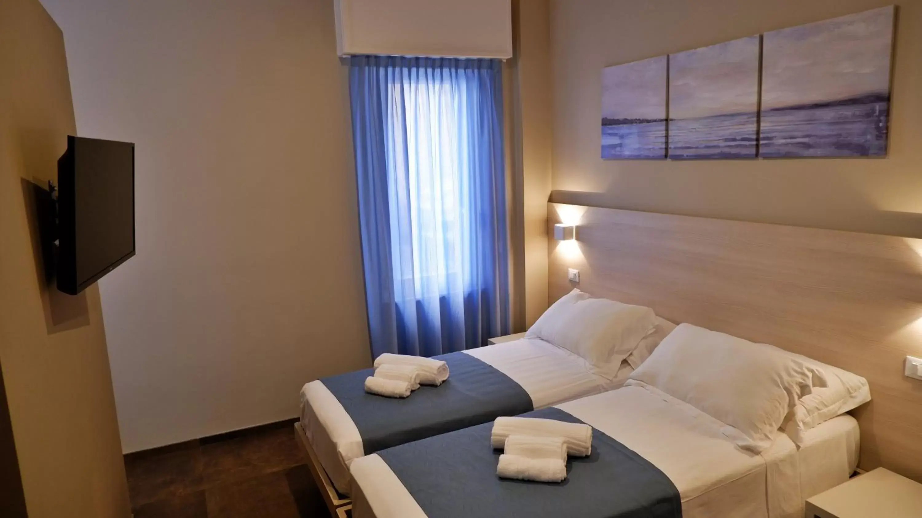 Bed in Pianomare Riviera Apartments and Rooms