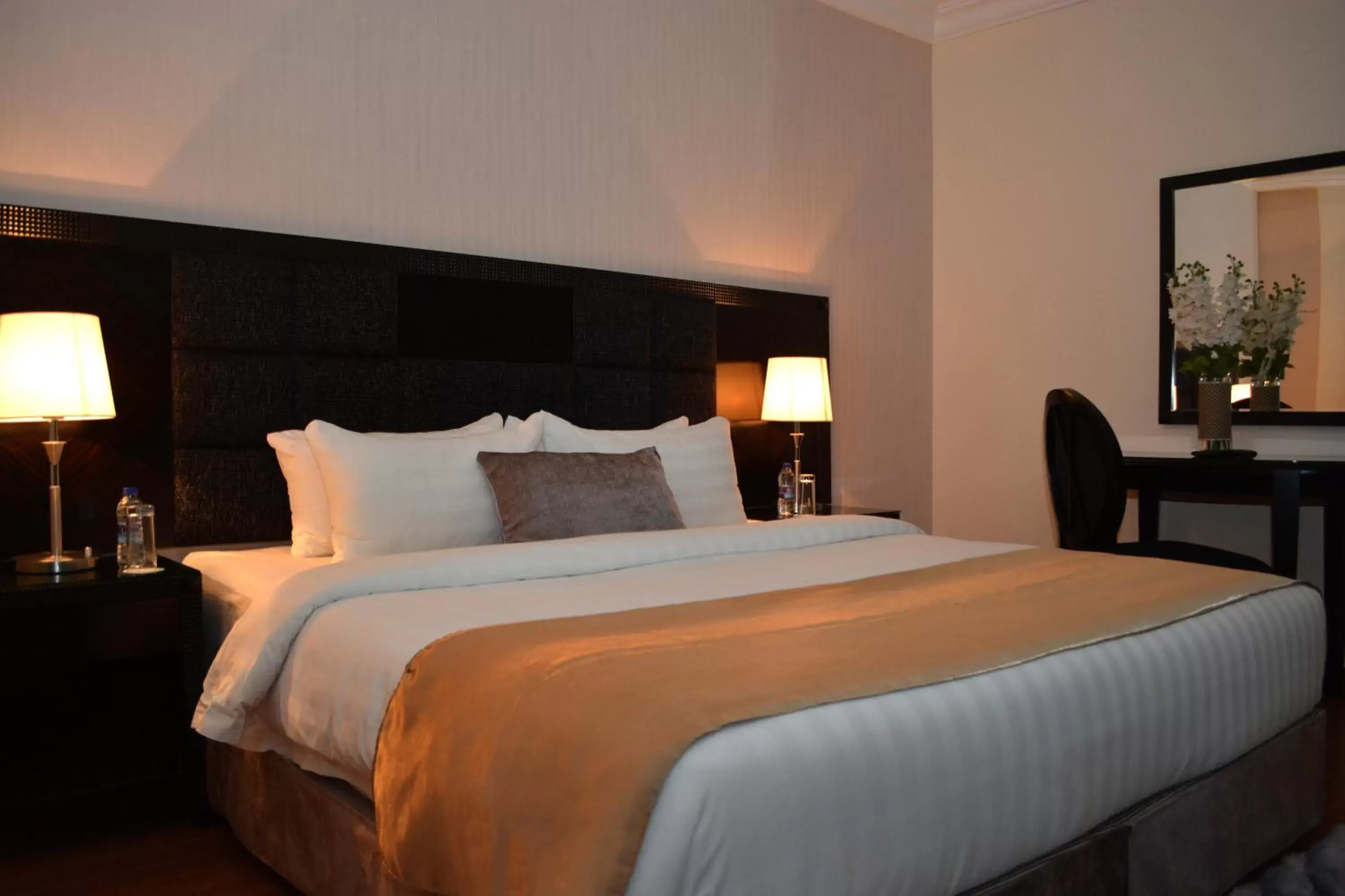 Bed in Tilal Almadina Hotel & Suites