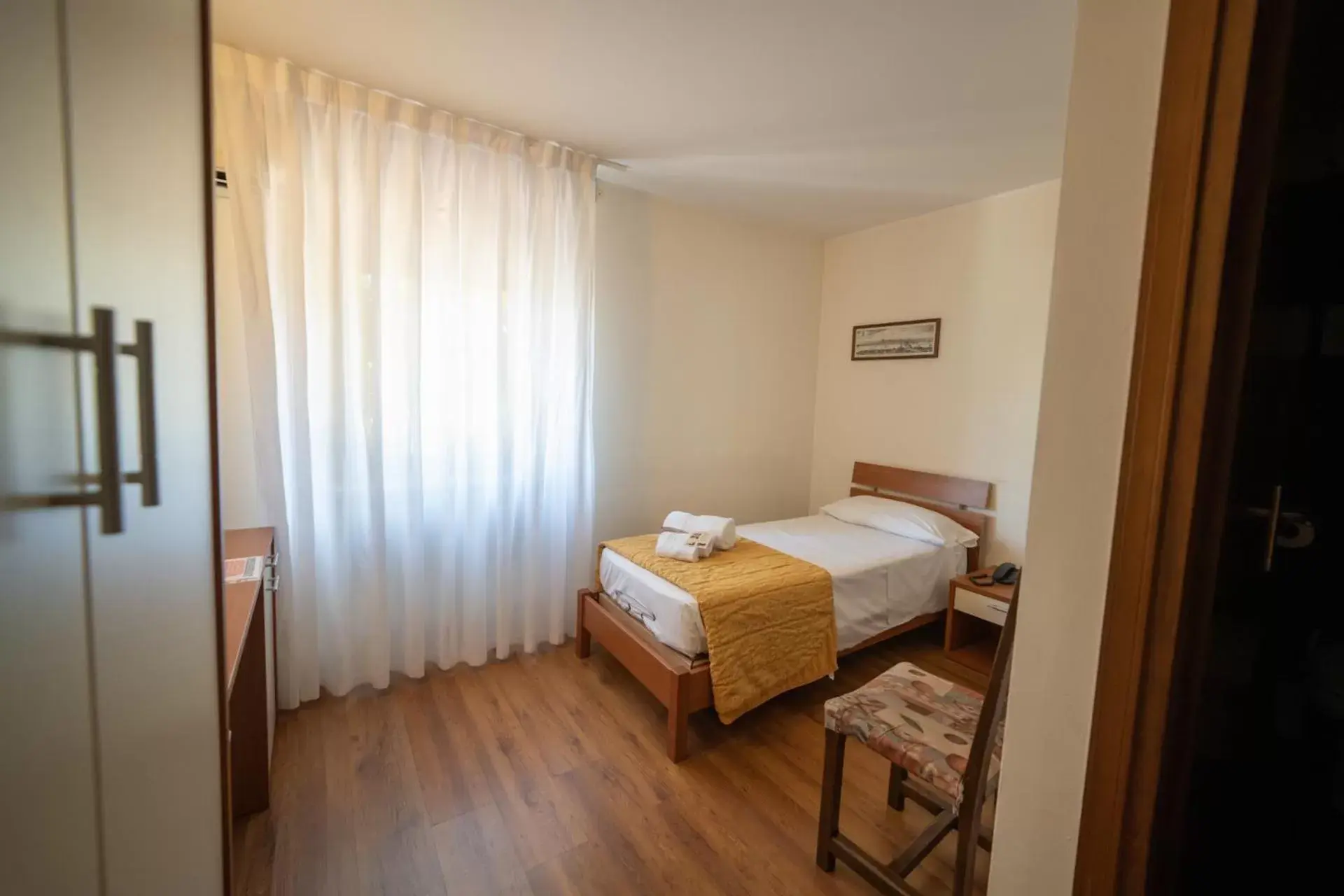 Bed in Hotel Siros