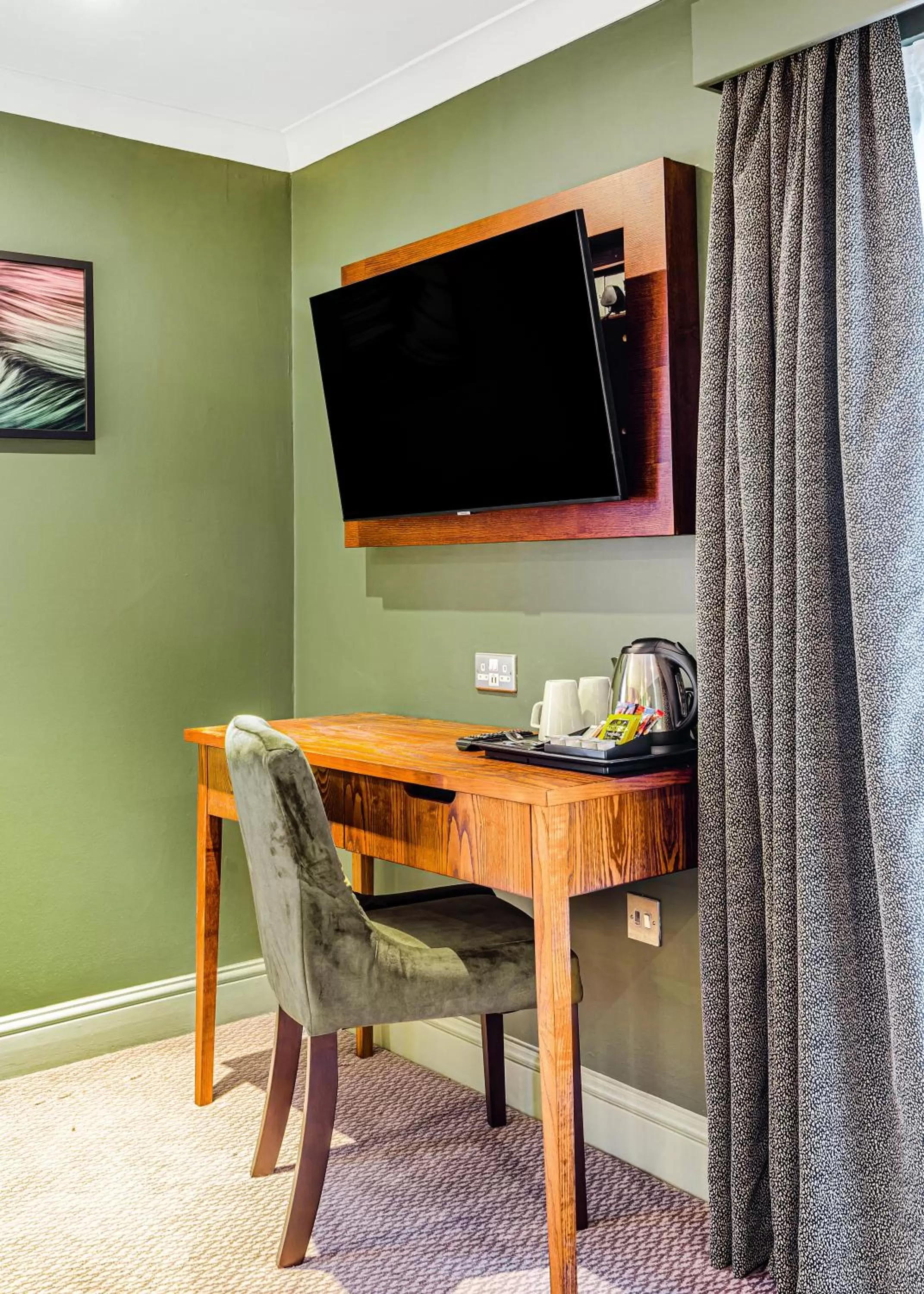 Coffee/tea facilities, TV/Entertainment Center in Inn on the Lake by Innkeeper's Collection