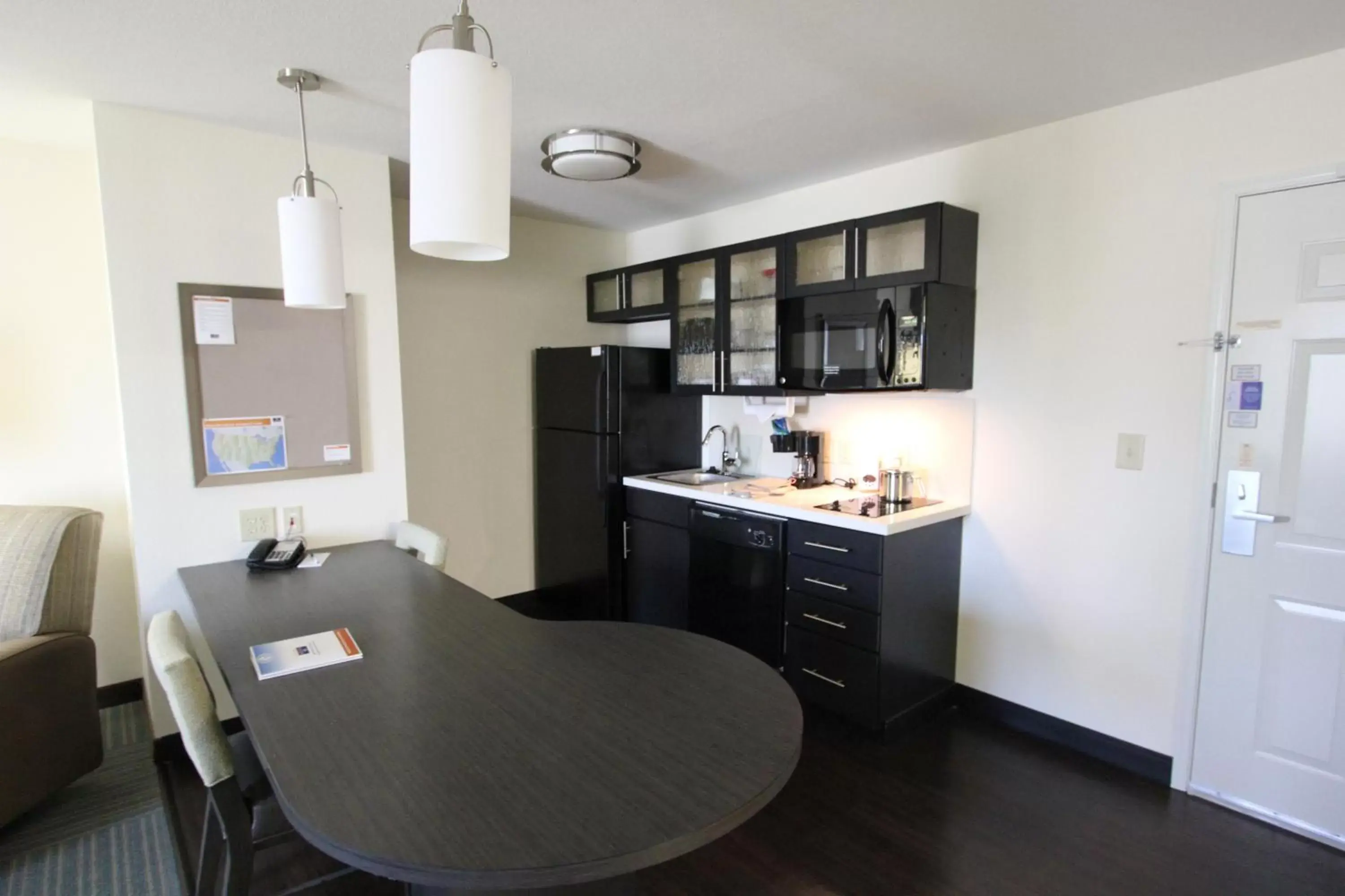 Photo of the whole room, Kitchen/Kitchenette in Candlewood Suites Greenville, an IHG Hotel