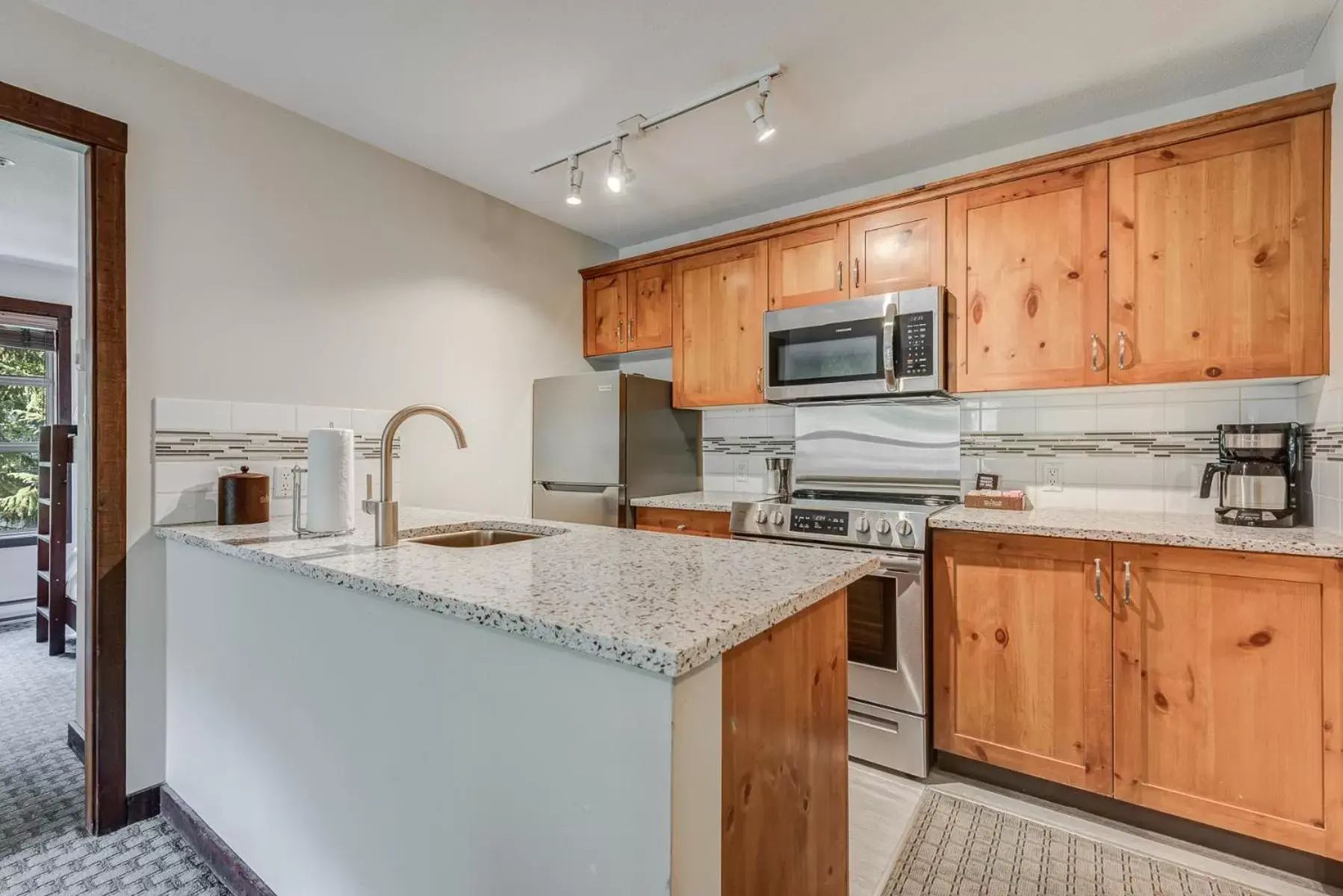 Kitchen or kitchenette, Kitchen/Kitchenette in Blackcomb Springs Suites by CLIQUE