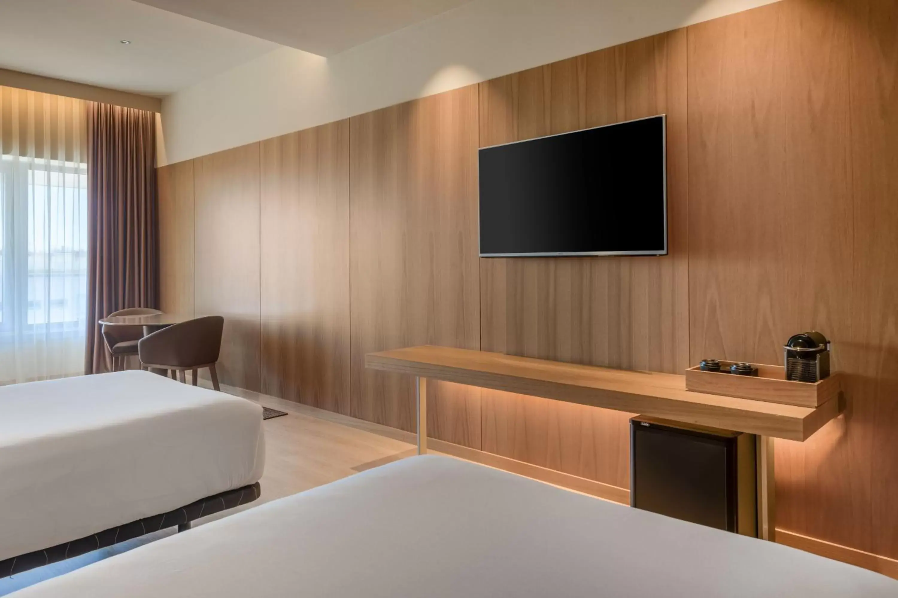Photo of the whole room, TV/Entertainment Center in AC Hotel Diagonal L'Illa by Marriott