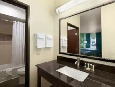 Bathroom in Super 8 by Wyndham Dilley TX