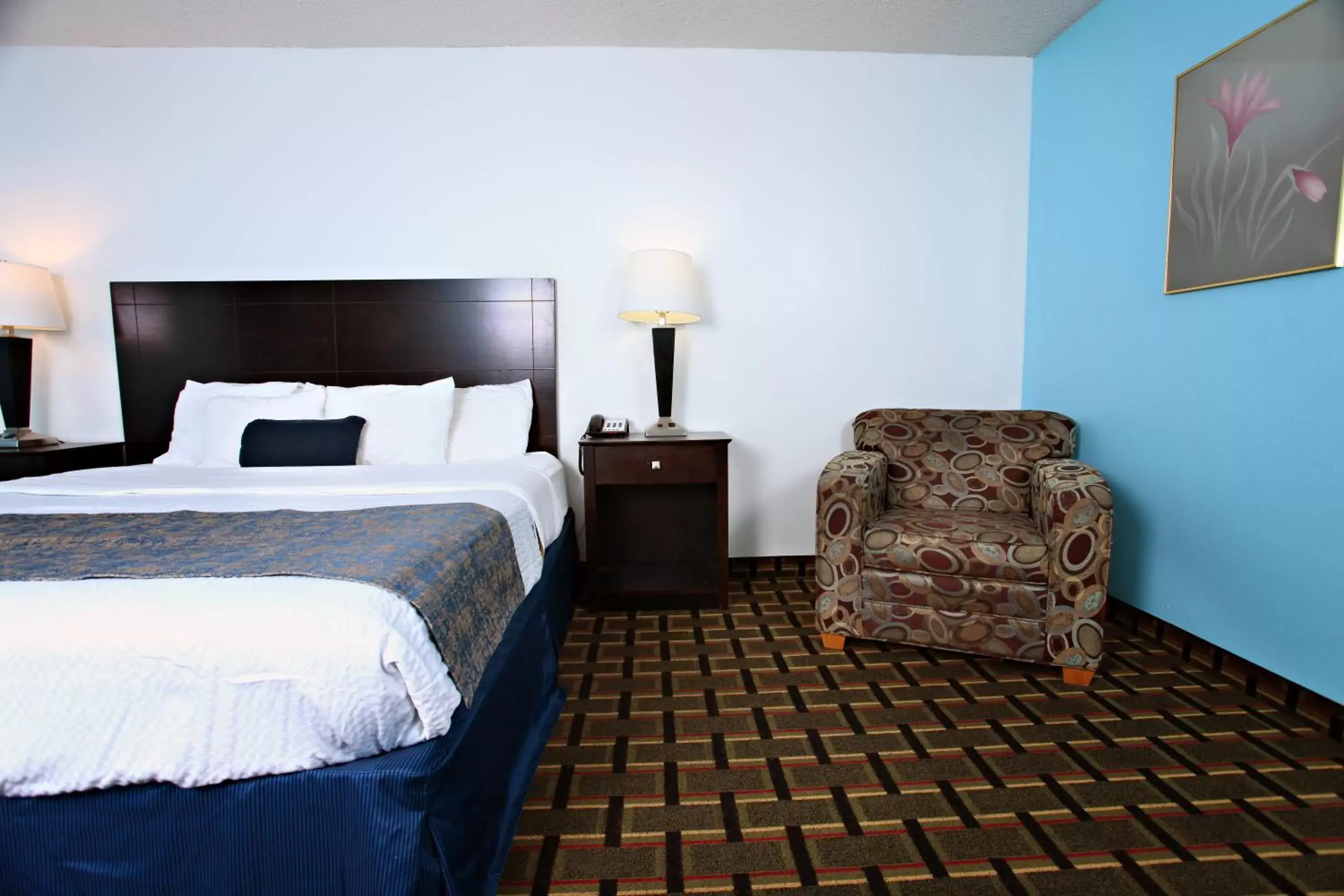 Bed in Coratel Inn & Suites by Jasper Newton