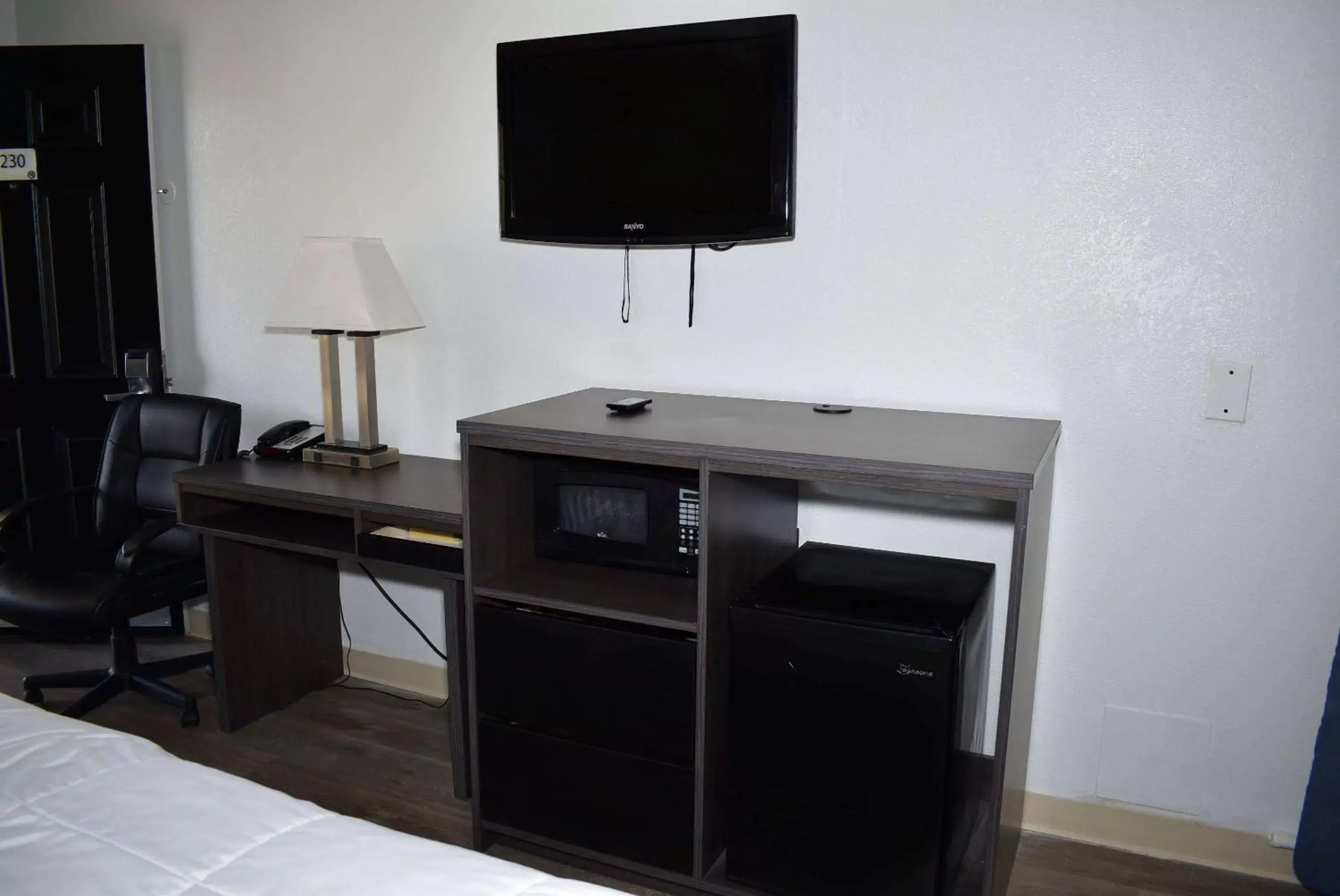 Photo of the whole room, TV/Entertainment Center in Super 8 by Wyndham Fredericksburg