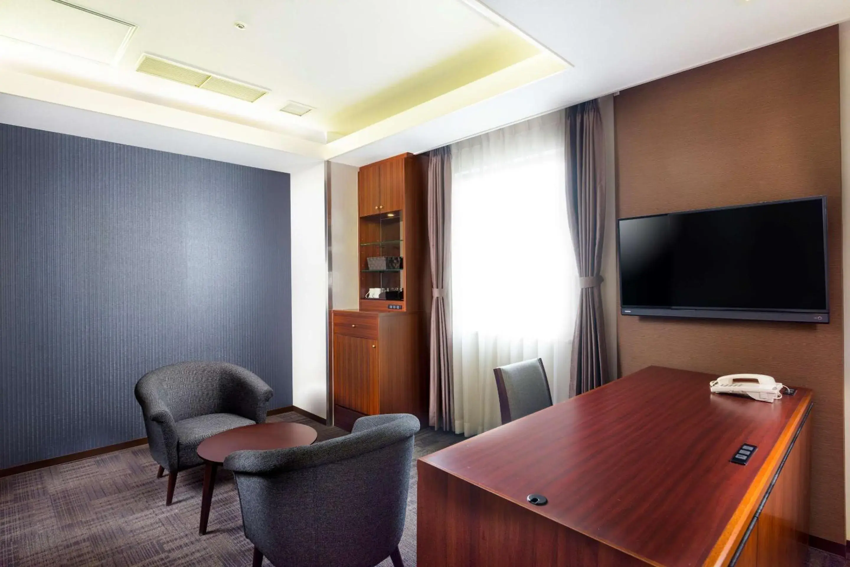 Bedroom, Seating Area in SureStay Plus Hotel by Best Western Shin-Osaka