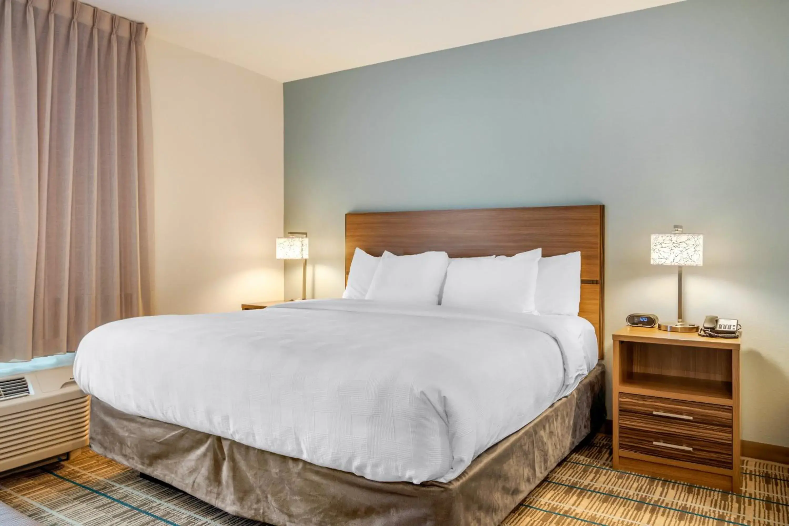 Bed in MainStay Suites Newnan Atlanta South