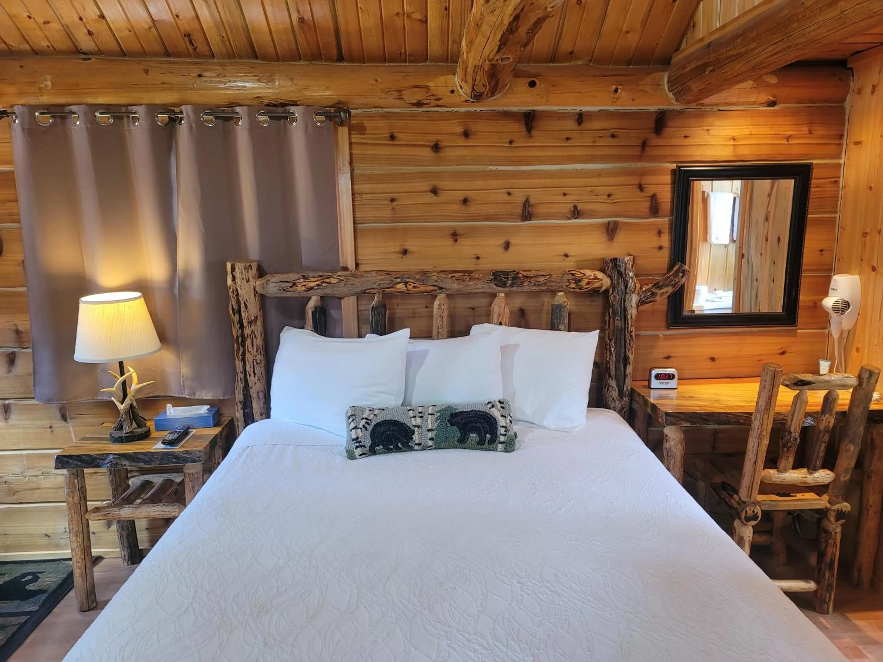 Bed in Riverfront Motel & Cabins