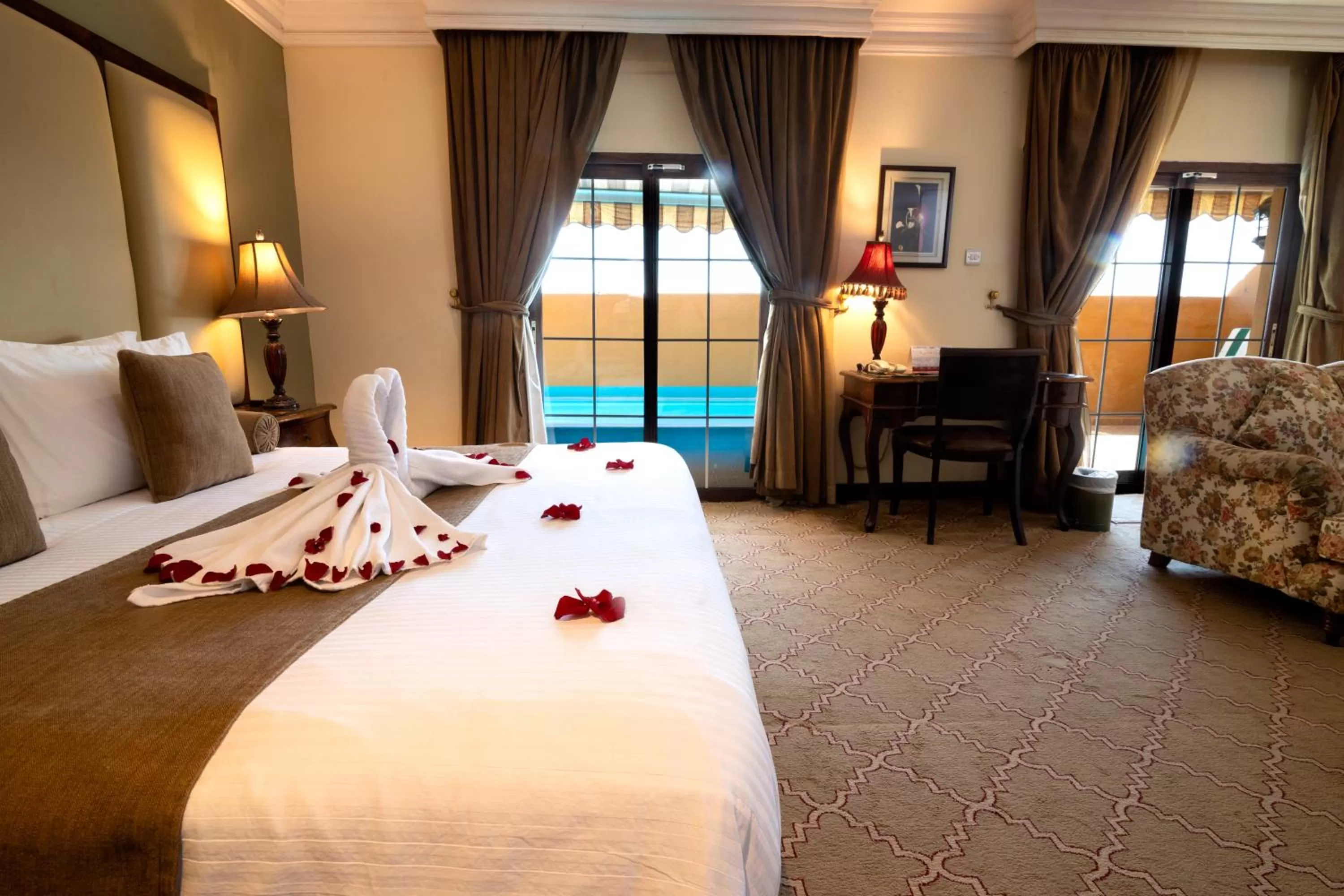 Bed in The Convention Center & Royal Suites Hotel