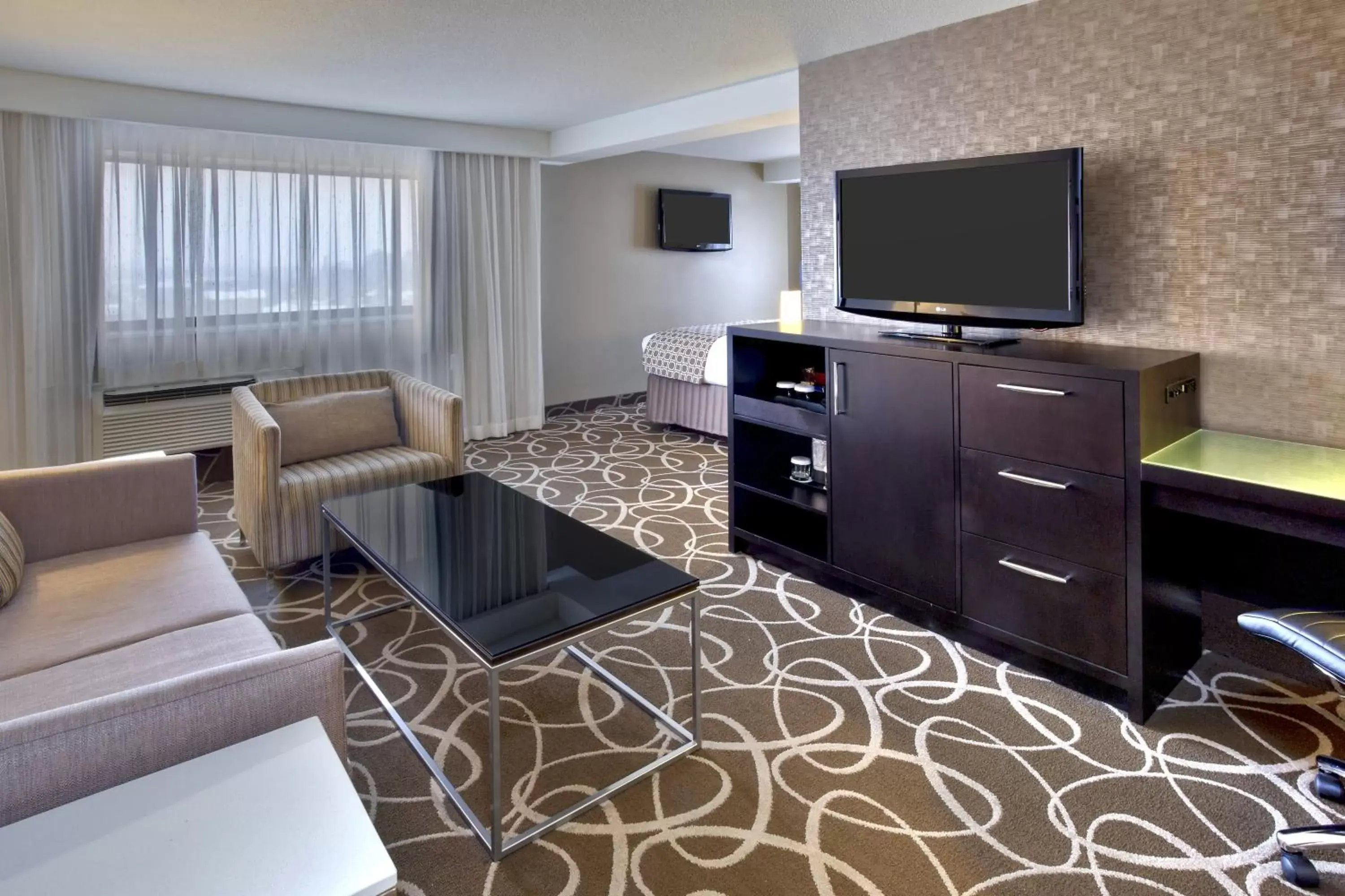 Photo of the whole room, TV/Entertainment Center in Crowne Plaza Kitchener-Waterloo, an IHG Hotel