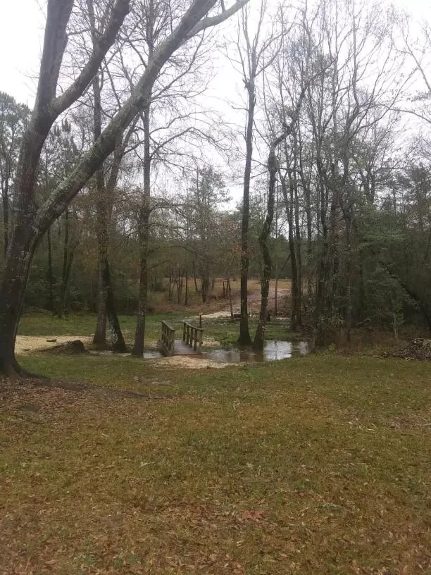 Property building, Garden in Whispering Creek Lodging & RV Resort