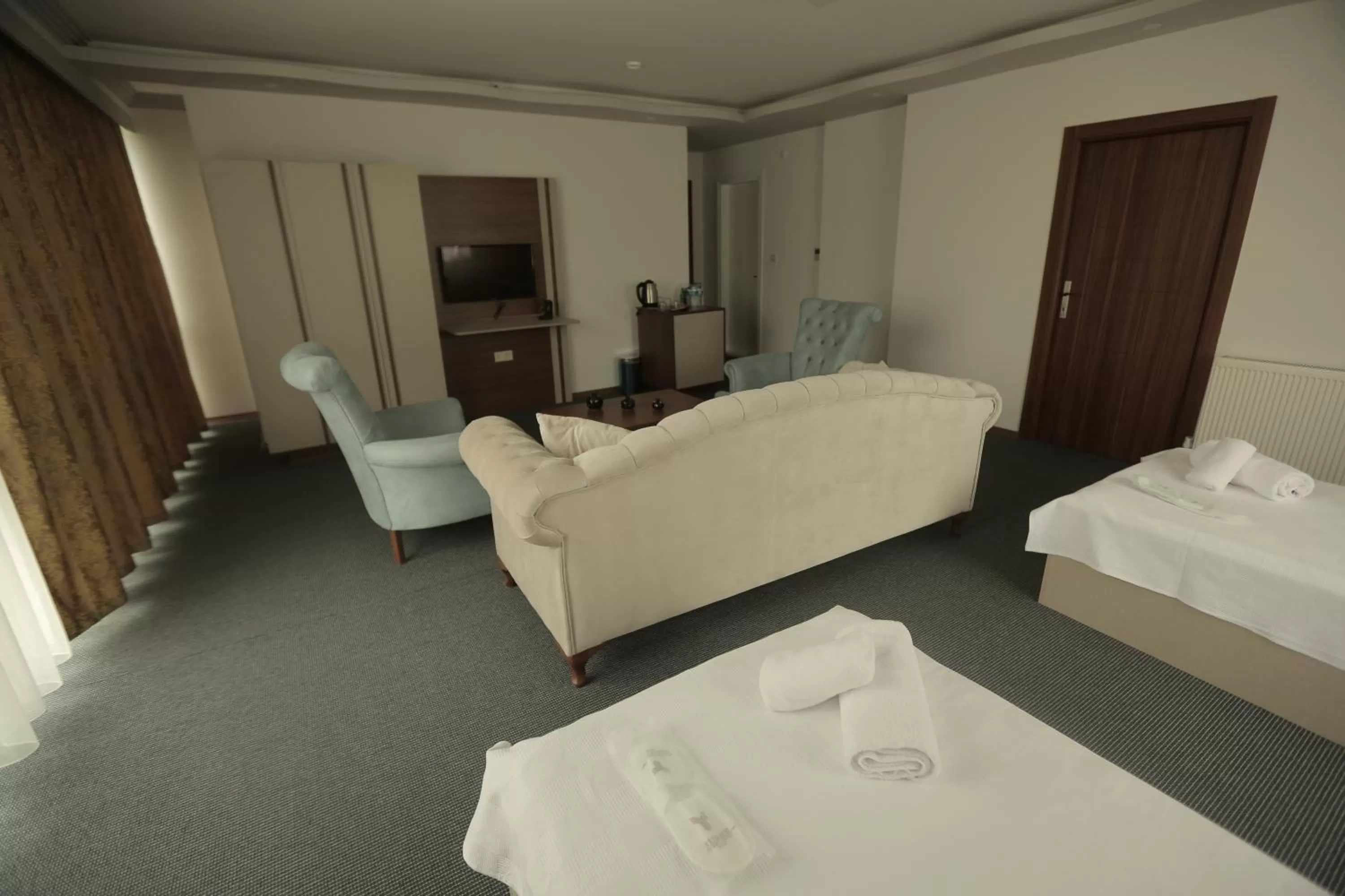 Bed in TEVETOGLU HOTEL