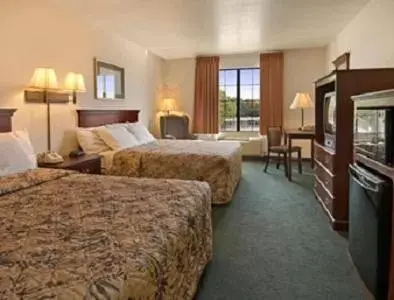 Bed in Prime Inn & Suites Poteau