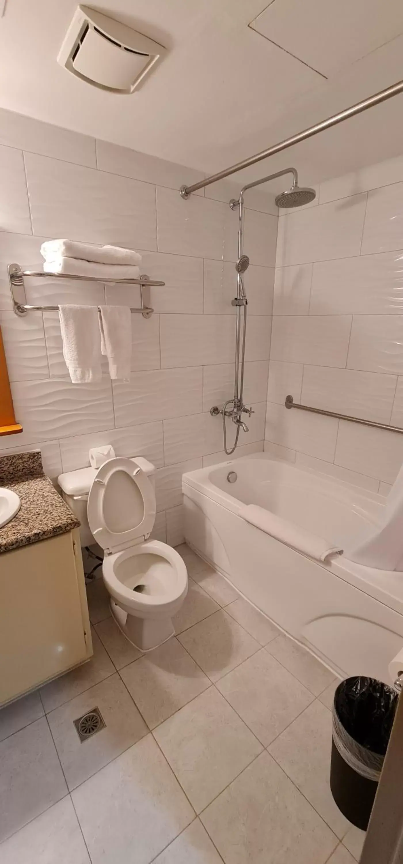 Bathroom in SureStay Hotel by Best Western Guam Palmridge