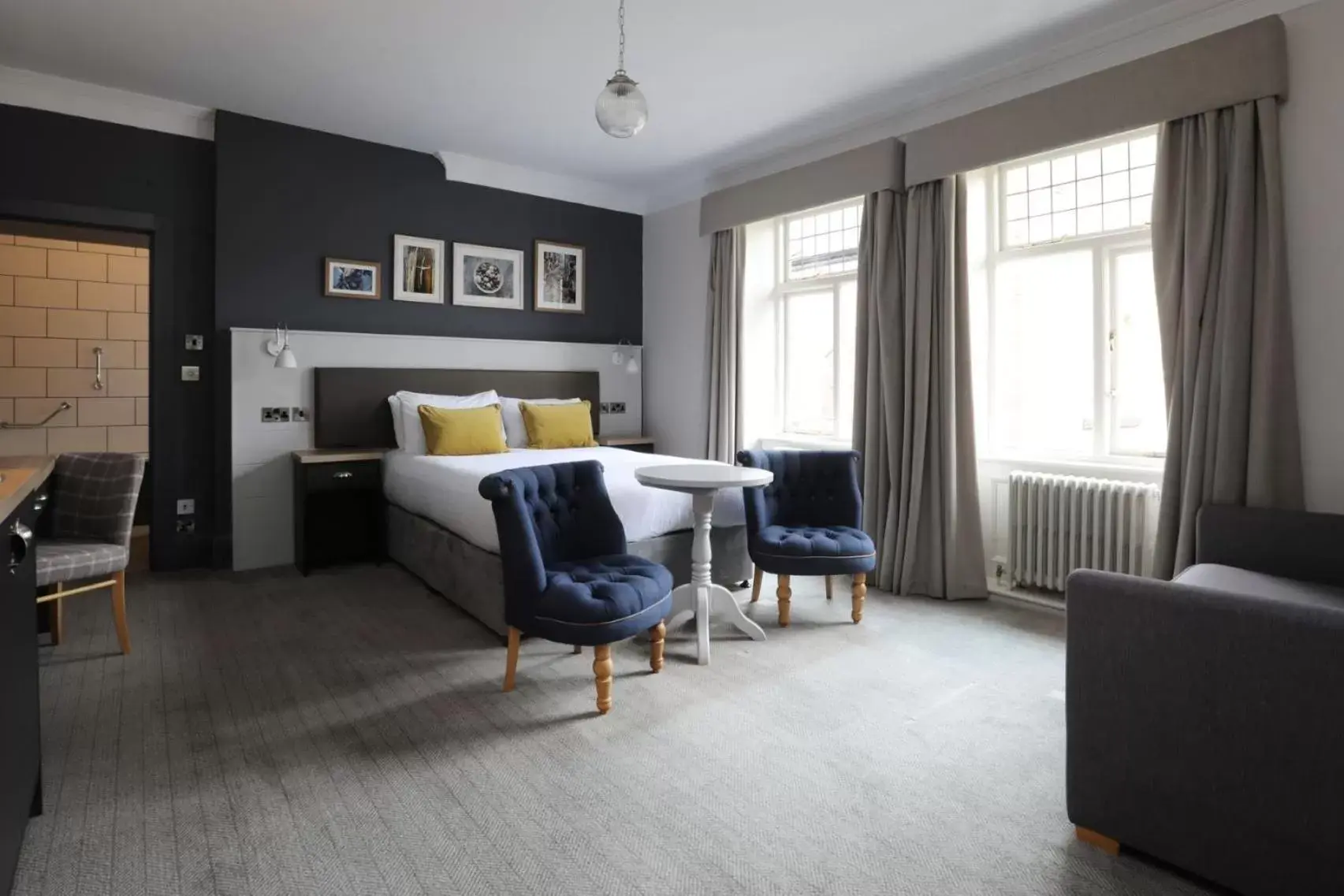 Bed, Seating Area in The Harrogate Inn - The Inn Collection Group