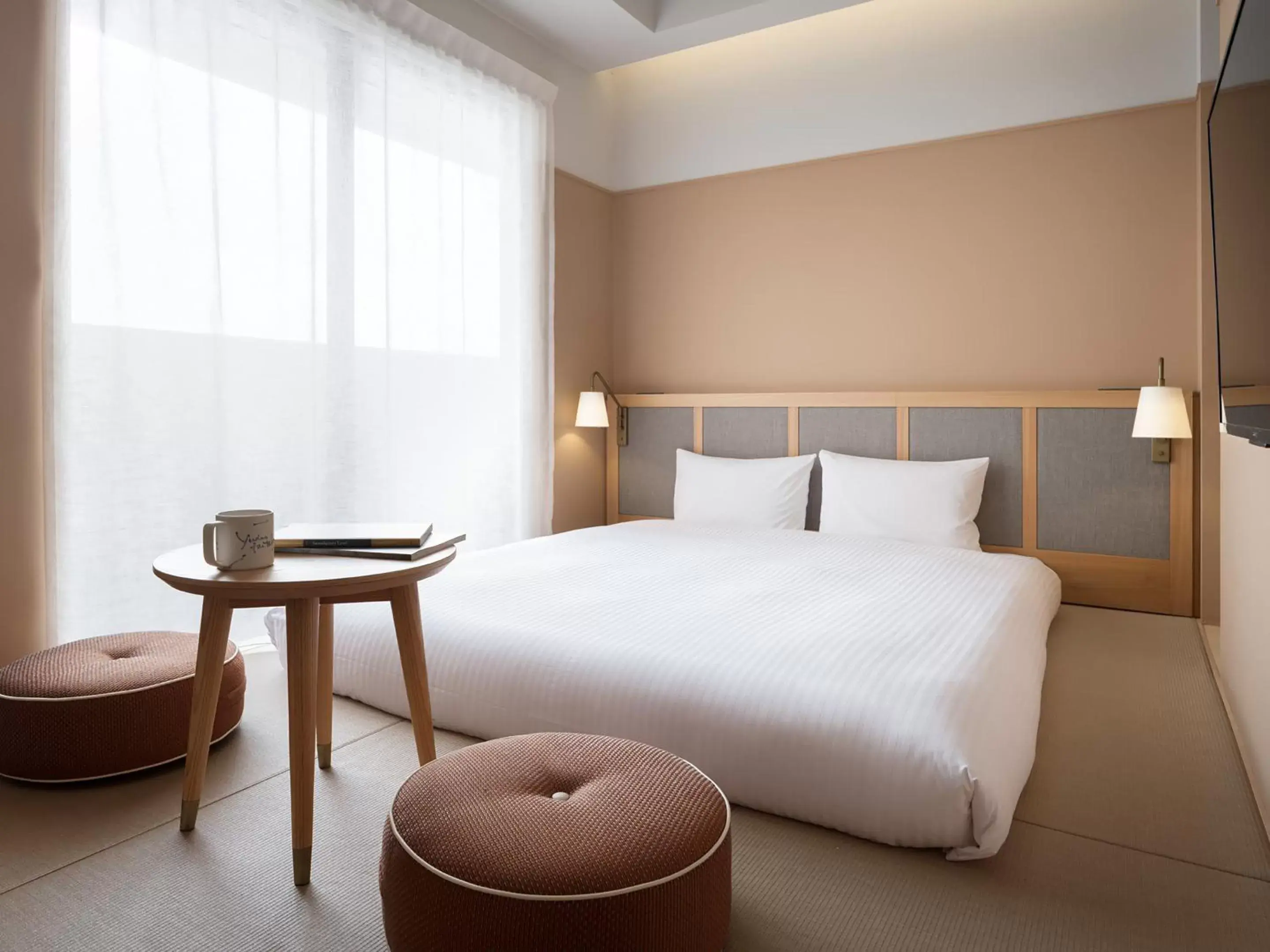 Bed in RAKURO Kyoto by THE SHARE HOTELS
