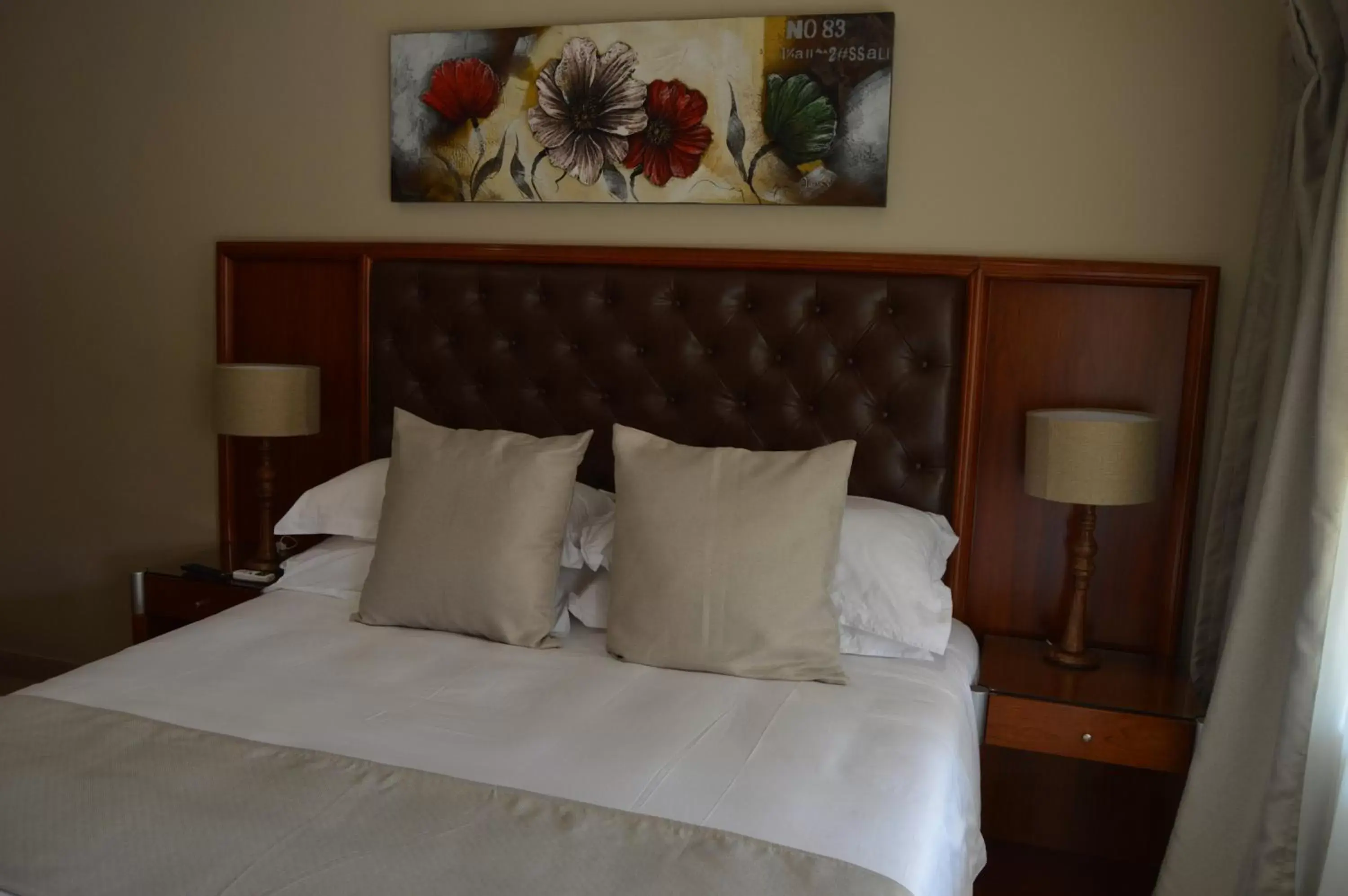 Bed in Airport Gardens Boutique Hotel