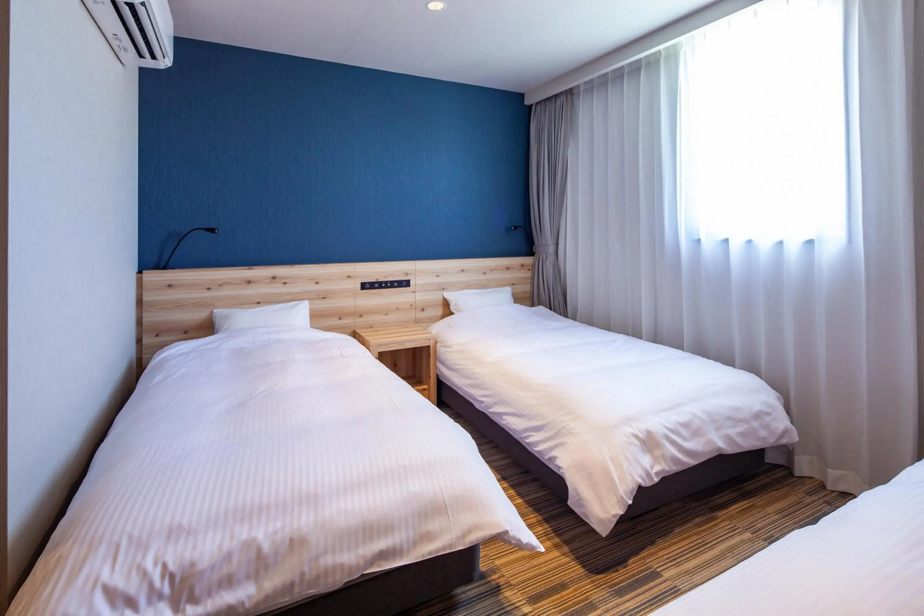 Photo of the whole room, Bed in Y's CABIN&HOTEL Naha Kokusai Street