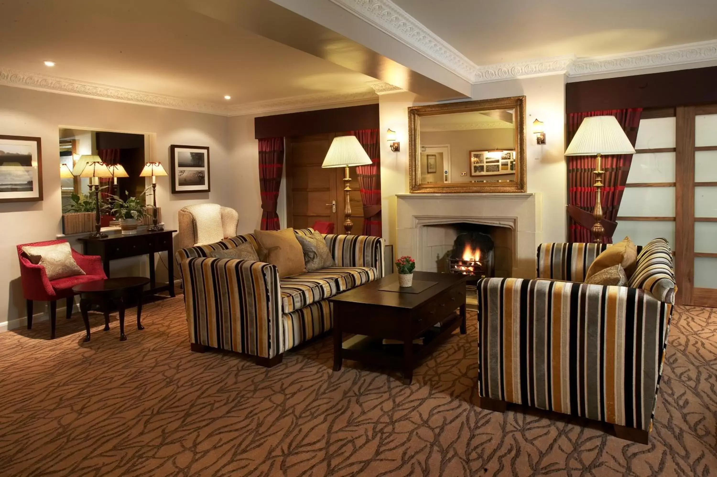 Communal lounge/ TV room, Seating Area in Three Ways House Hotel