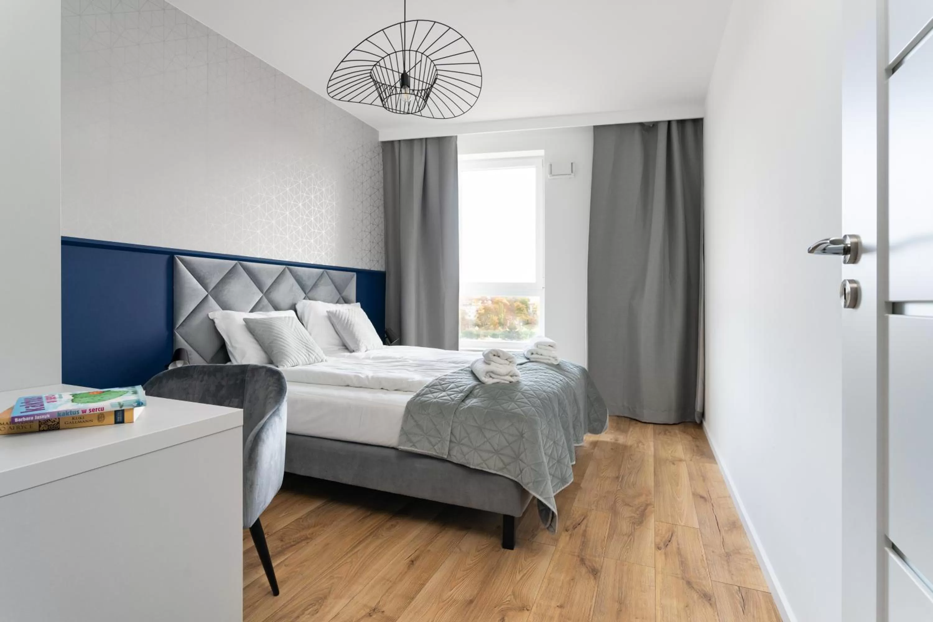 Bed in Symphony Modern Tower Apartamenty