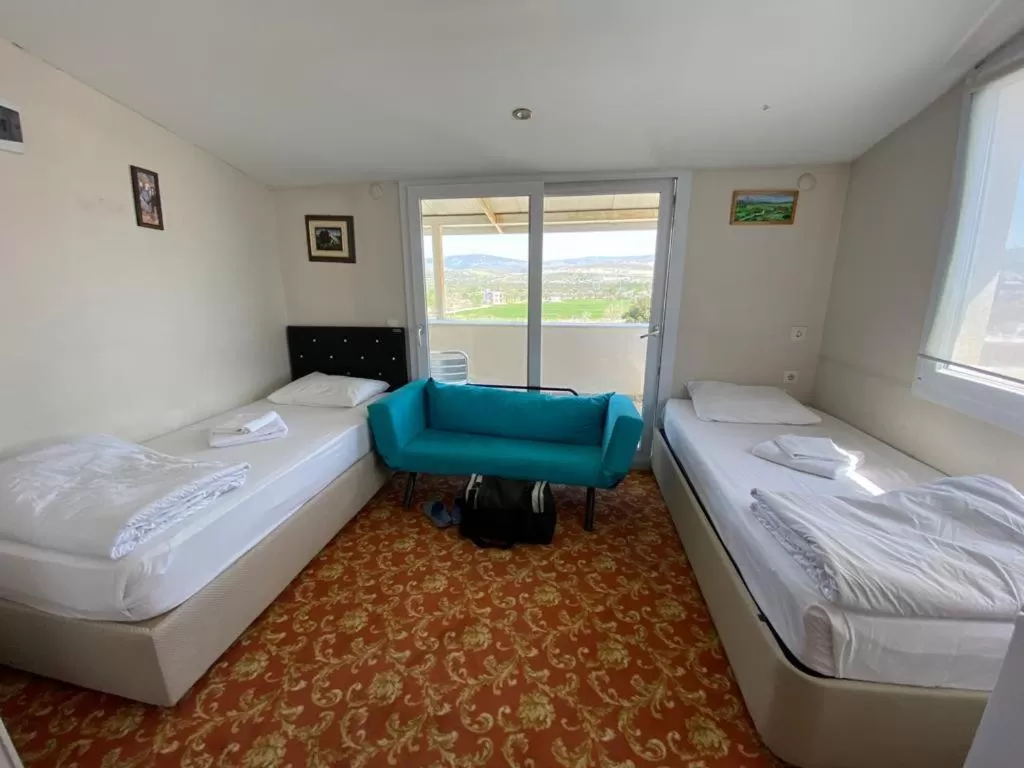 Seating area, Bed in Sakran Hotel