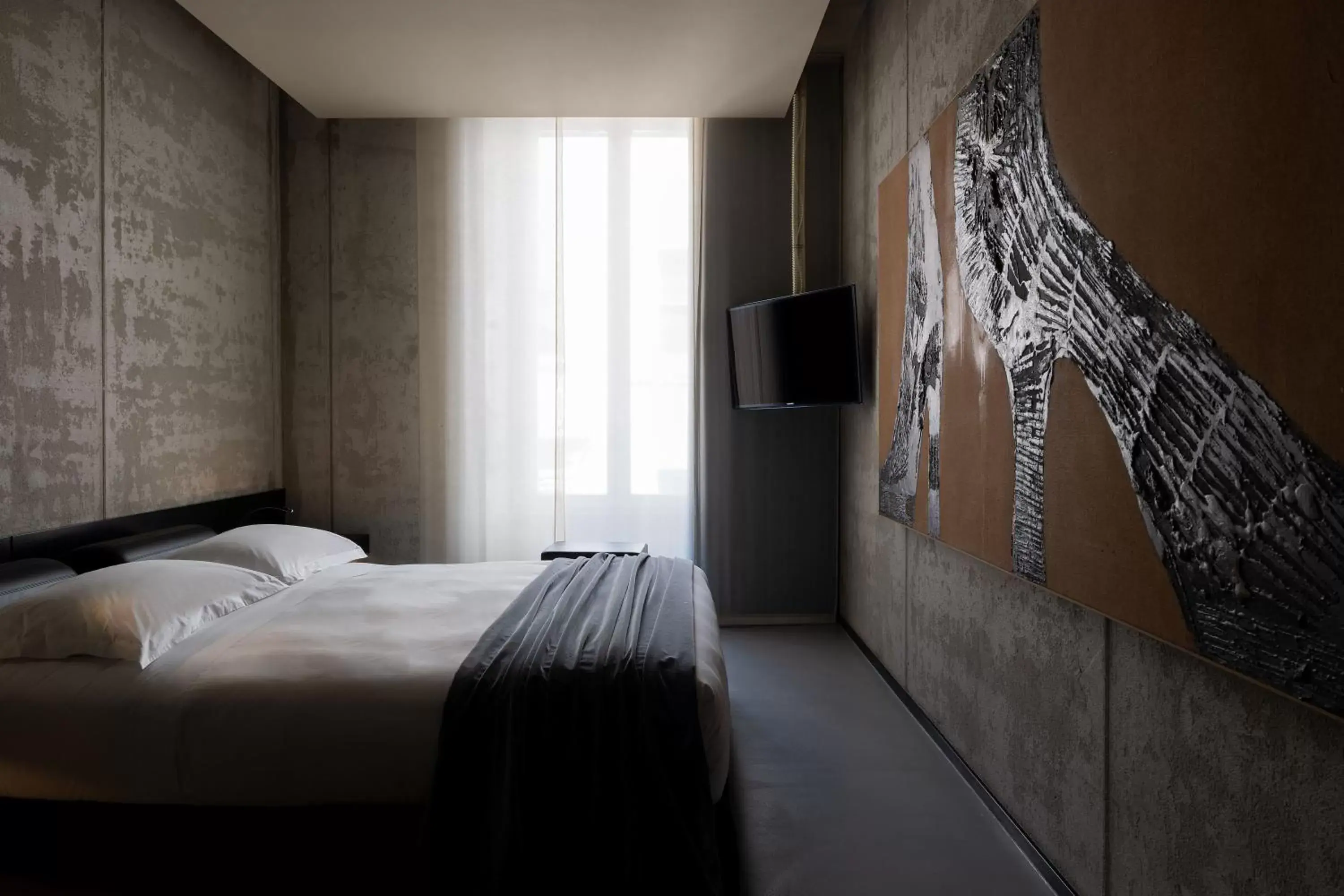 Bed in STRAF, Milan, a Member of Design Hotels