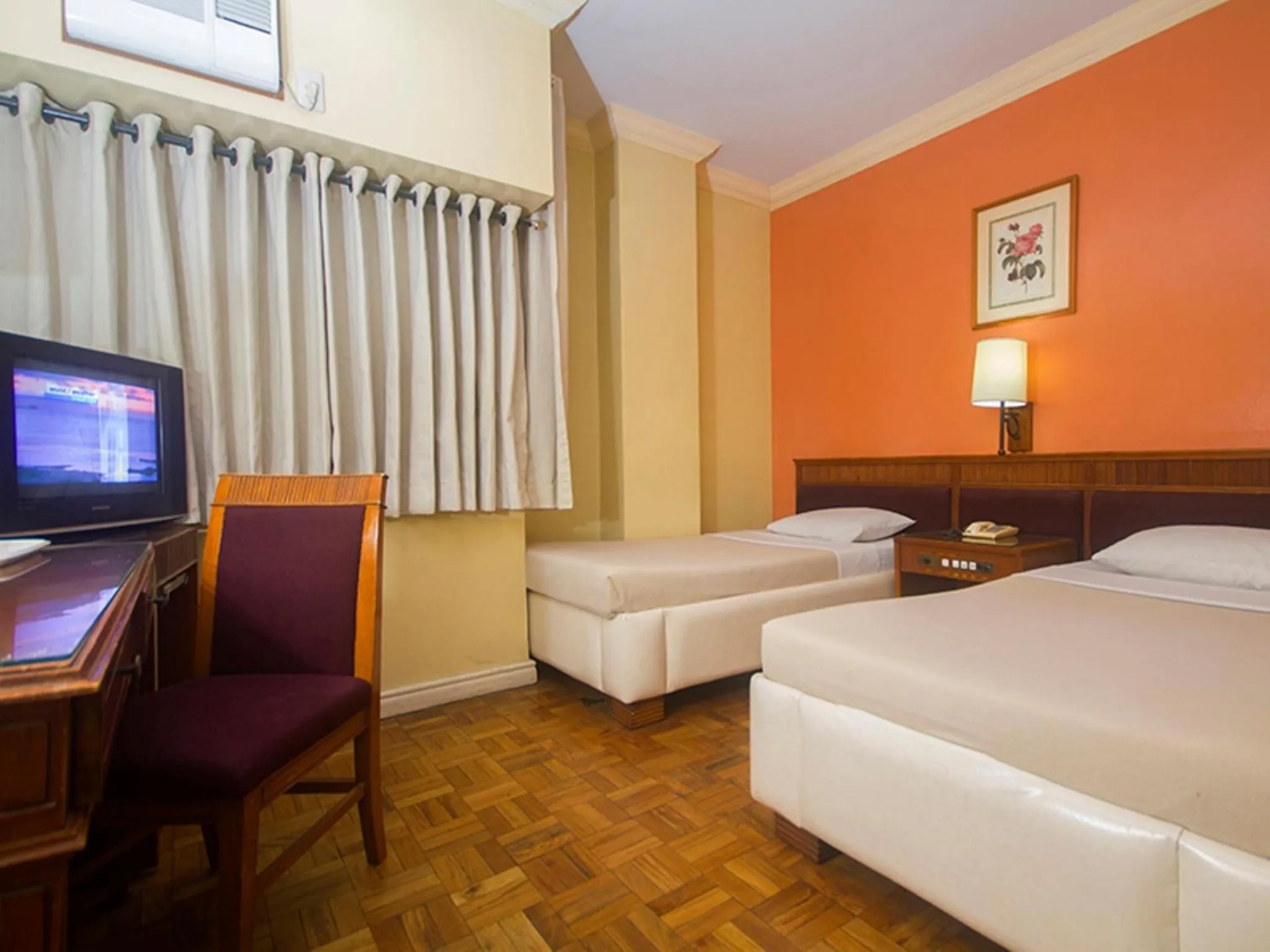Bed in Grand City Hotel Inc.